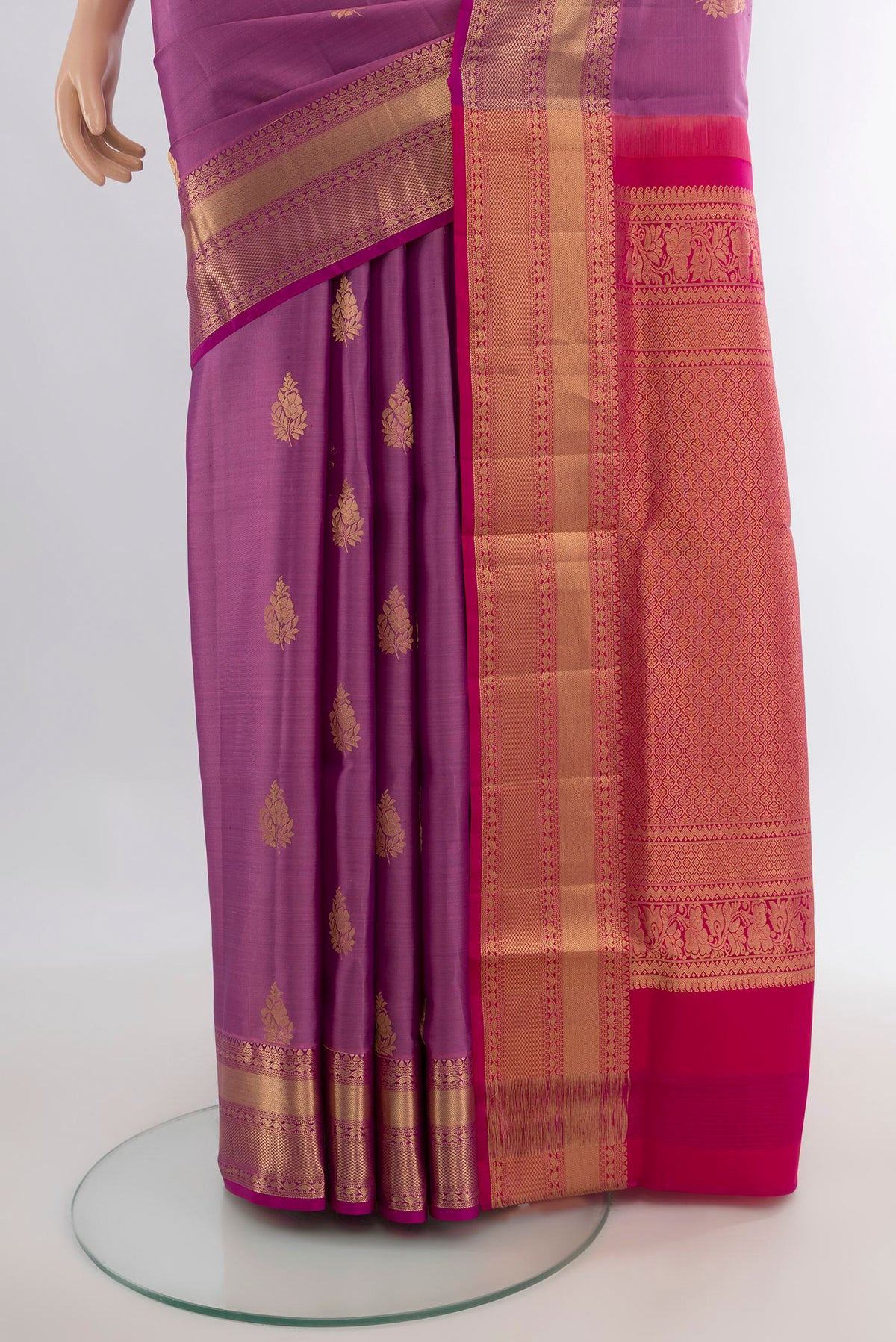 Pleats and pallu of Pure Silk Lavender Soft Saree with Zari Butta on the body and Zari Border. 