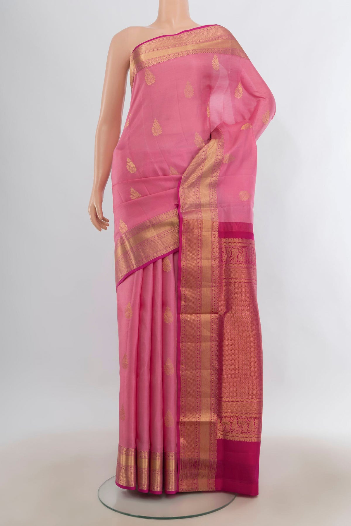 Pure Silk Rose pink Soft Saree with Zari Butta on the body and Zari Border.  displayed on a mannequin