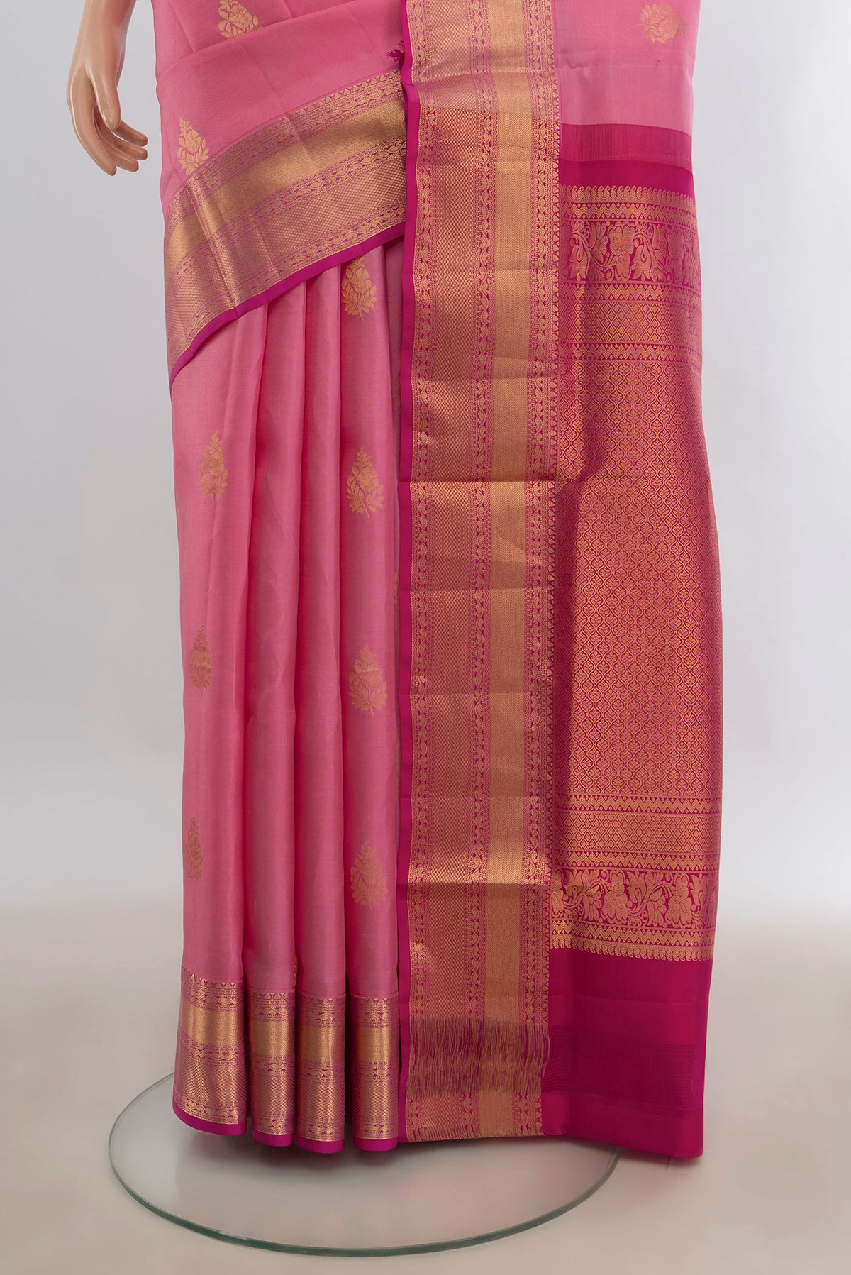 Pleats and pallu of Pure Silk Rose pink Soft Saree with Zari Butta on the body and Zari Border. 