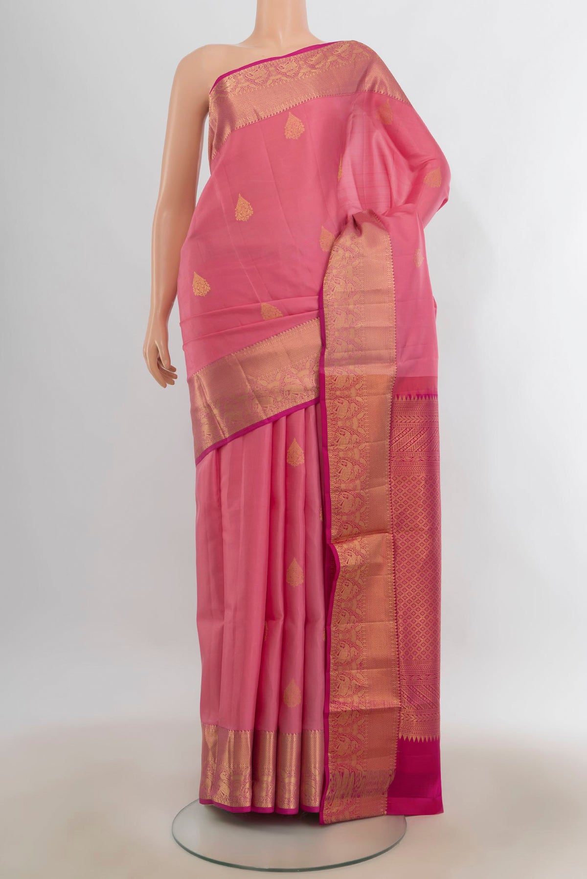 Pure Silk Rose pink Soft Saree with Zari Butta on the body and Zari Border.  displayed on a mannequin