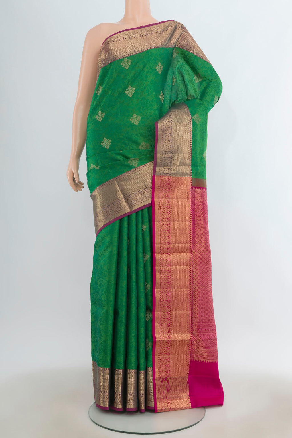 Pure Silk Green Soft Saree with Jacquard With Zari Butta on the body and Zari Border.  displayed on a mannequin
