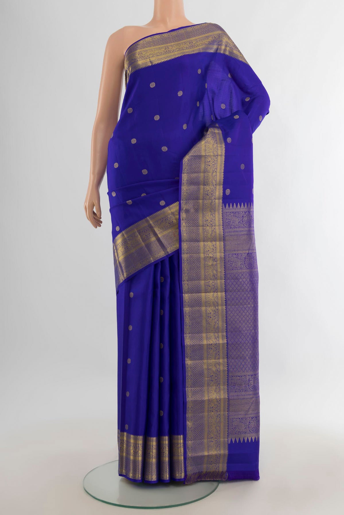 Pure Silk Royal Blue Kanchipuram Saree with Zari Butta on the body and Zari Border.  displayed on a mannequin