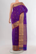 Pure Silk Purple Kanchipuram Saree with Zari Butta on the body and Zari Border.  displayed on a mannequin