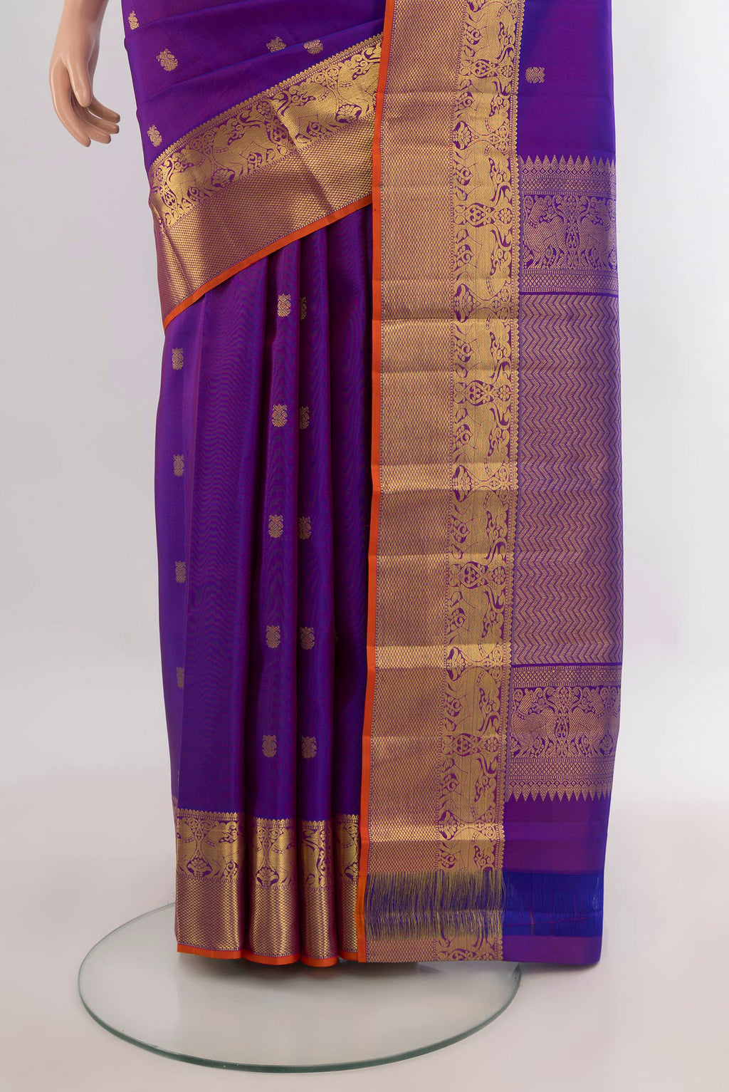 Pleats and pallu of Pure Silk Purple Kanchipuram Saree with Zari Butta on the body and Zari Border. 