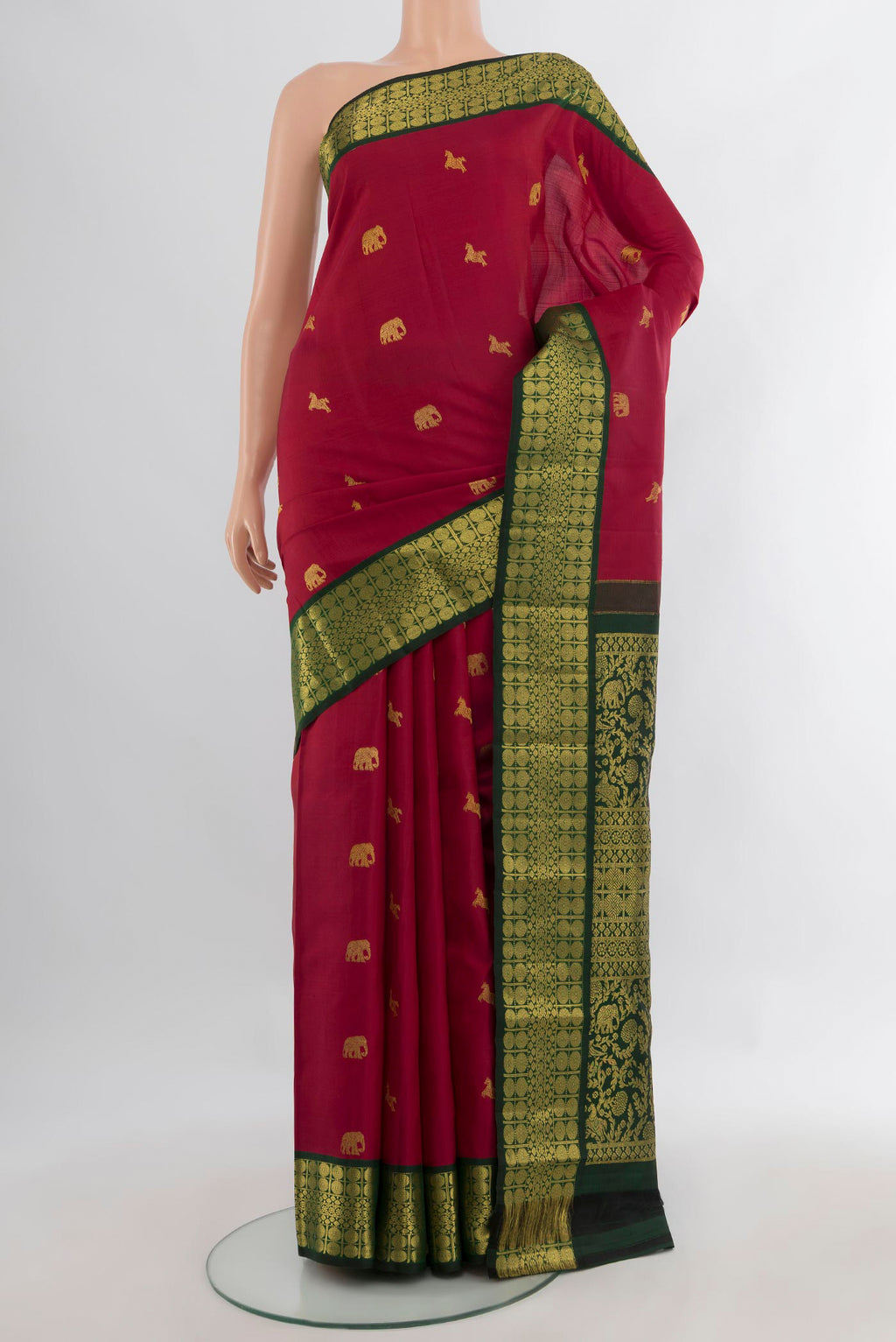 Pure Silk Deep Red Kanjivaram Saree with Zari Butta on the body and Zari Border.  displayed on a mannequin