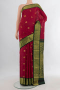 Pure Silk Deep Red Kanjivaram Saree with Zari Butta on the body and Zari Border.  displayed on a mannequin