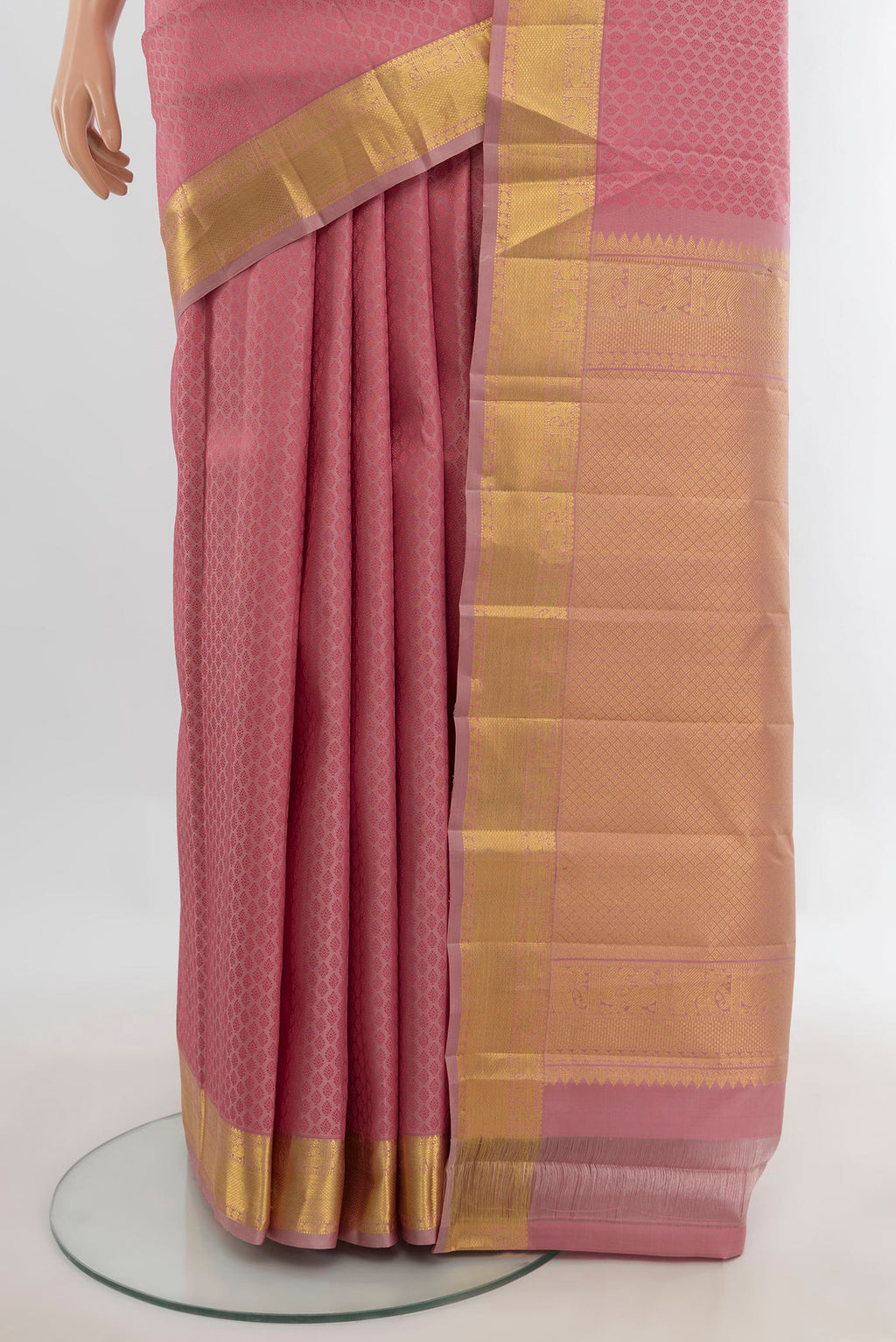 Pleats and pallu of Pure Silk Coral Kanjivaram Saree with Jacquard design on the body and Zari Border. 