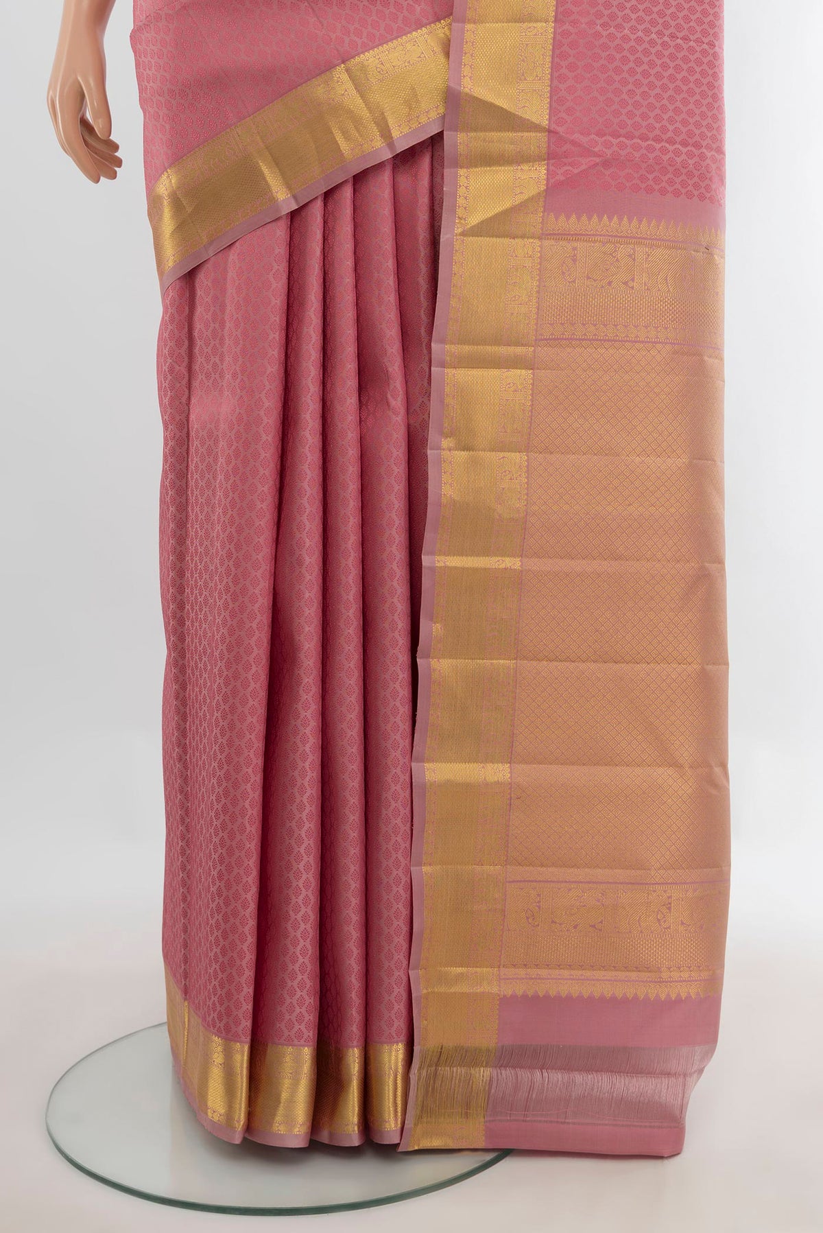 Pleats and pallu of Pure Silk Coral Kanjivaram Saree with Jacquard design on the body and Zari Border. 