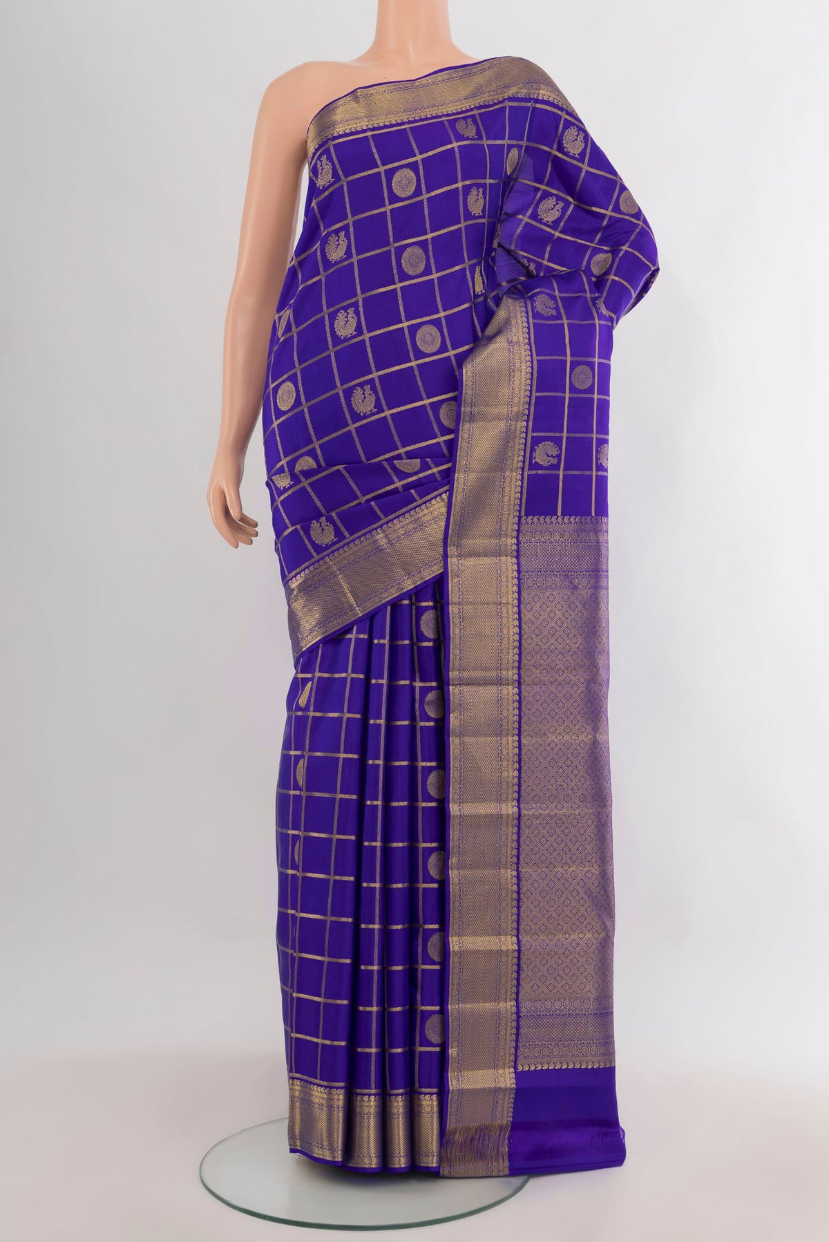 Pure Silk Royal Blue Kanjivaram Saree with Checked design on the body and Zari Border.  displayed on a mannequin