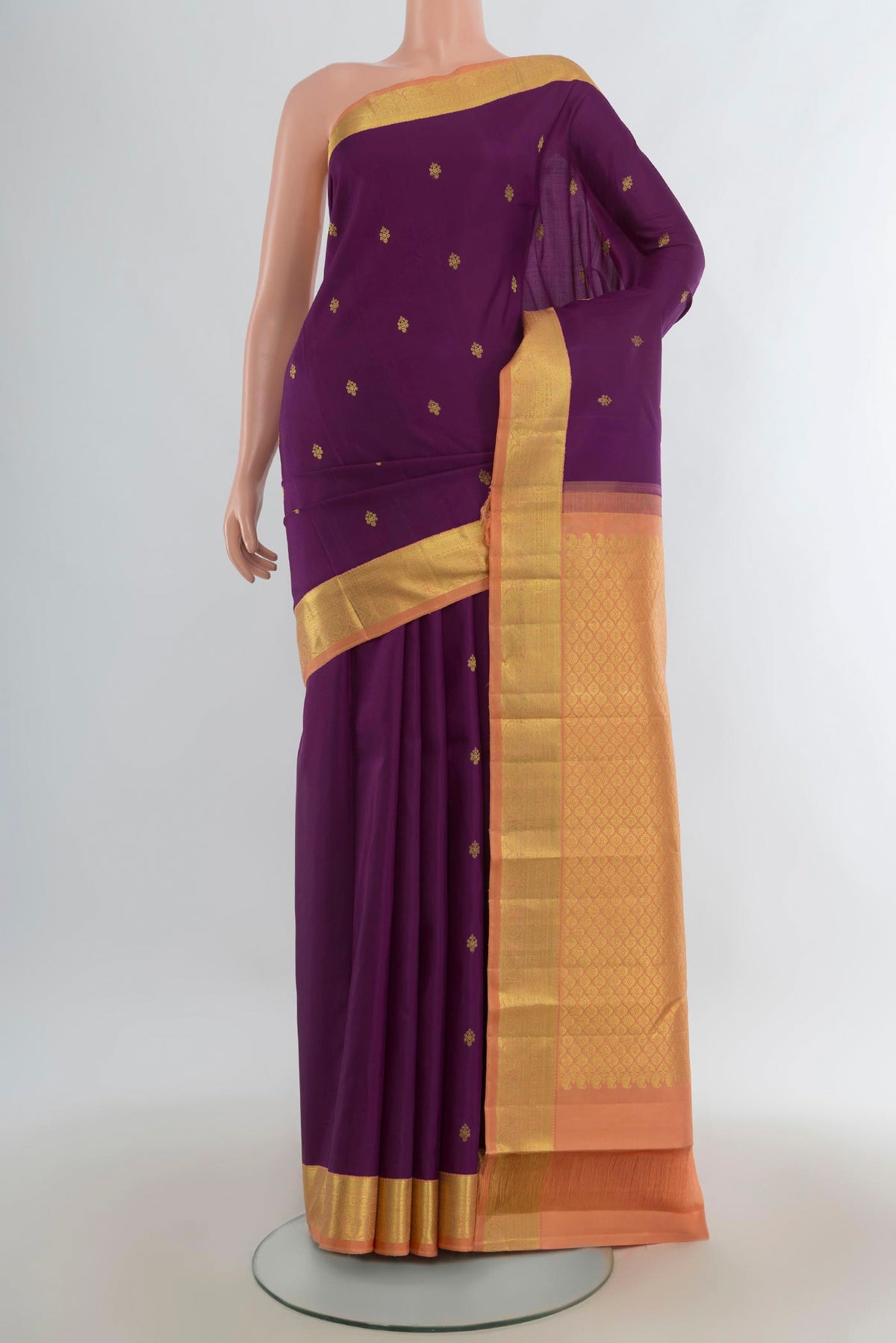 Pure Silk Purple Kanjivaram Saree with Zari Butta on the body and Zari Border.  displayed on a mannequin