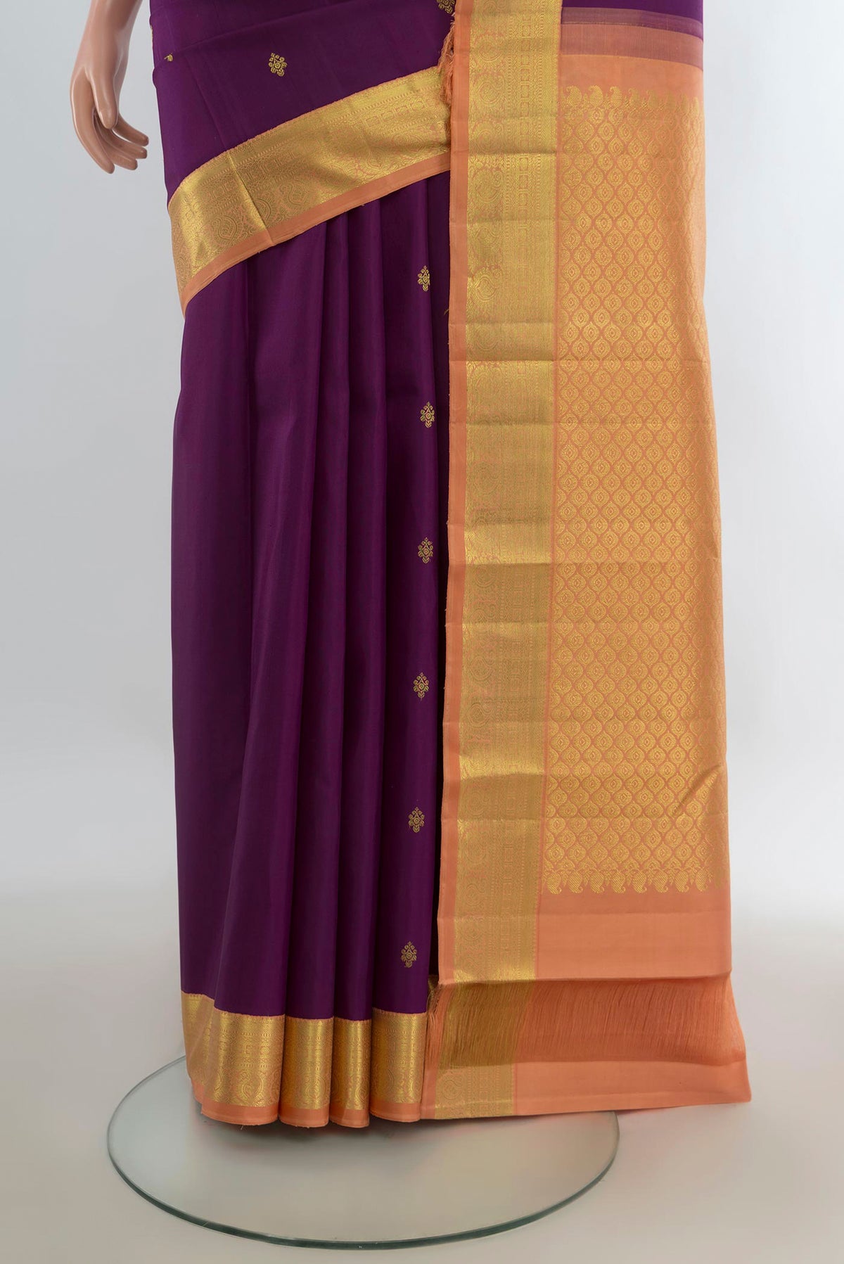 Pleats and pallu of Pure Silk Purple Kanjivaram Saree with Zari Butta on the body and Zari Border. 
