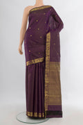 Pure Silk Purple Kanjivaram Saree with Zari Butta on the body and Zari Border.  displayed on a mannequin