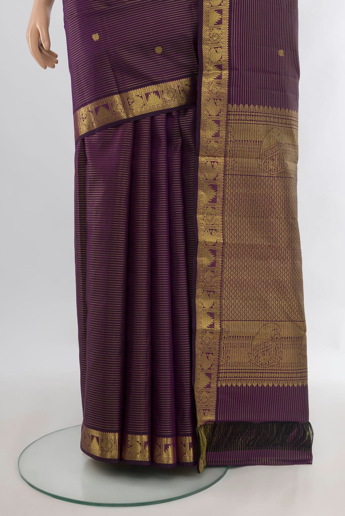 Pleats and pallu of Pure Silk Purple Kanjivaram Saree with Zari Butta on the body and Zari Border. 