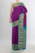 Pure Silk Purple Kanchipuram Saree with Zari Butta on the body and Zari Border.  displayed on a mannequin