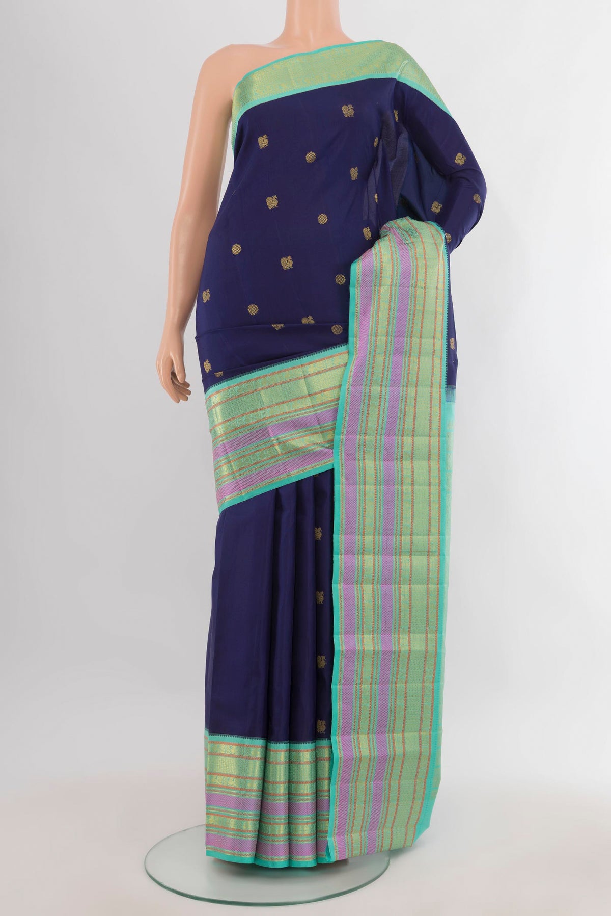 Pure Silk Navy Blue Kanjivaram Saree with Zari Butta on the body and Zari Border.  displayed on a mannequin