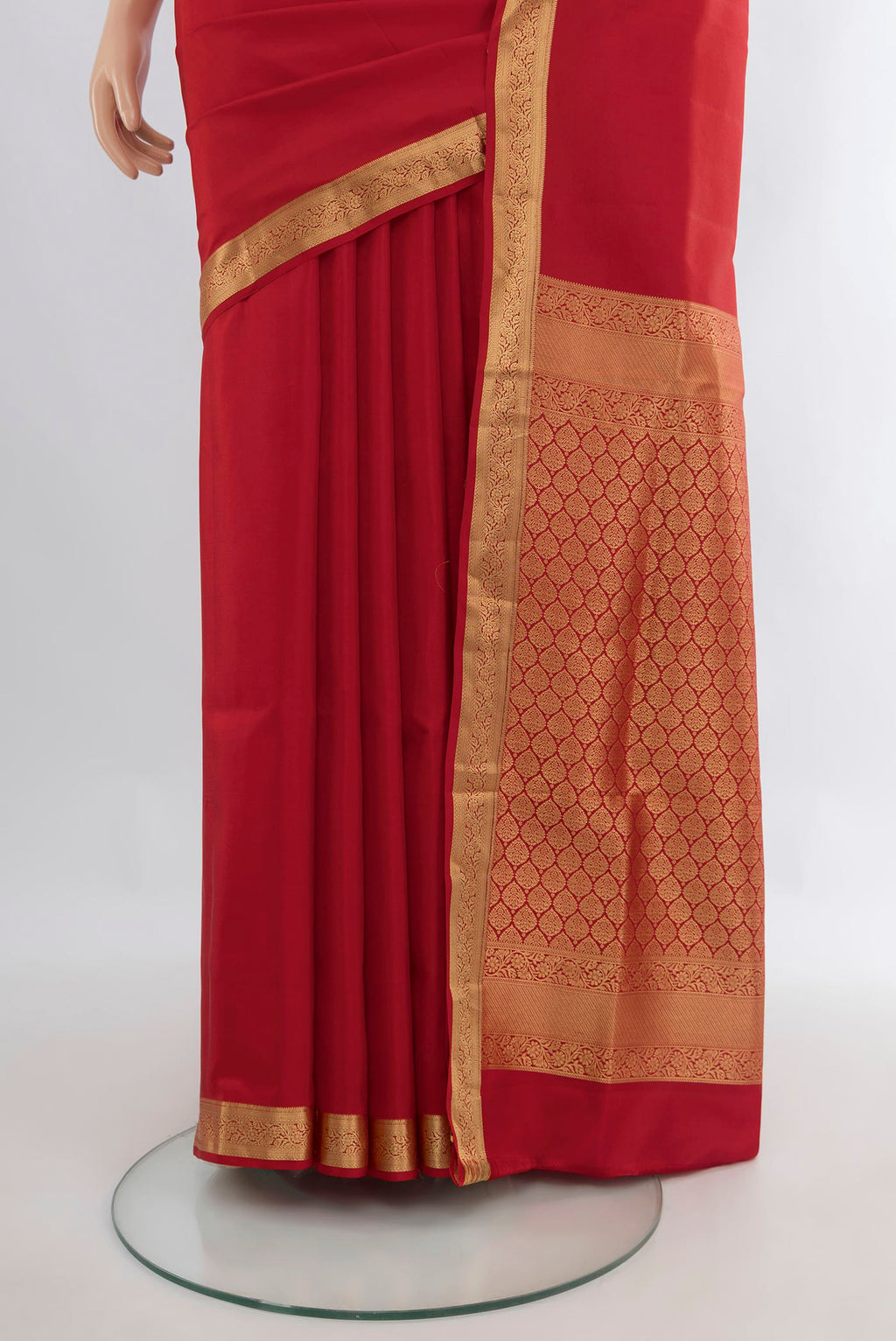 Pleats and pallu of Pure Silk Red Soft Saree with Zari Butta on the body and Zari Border. 