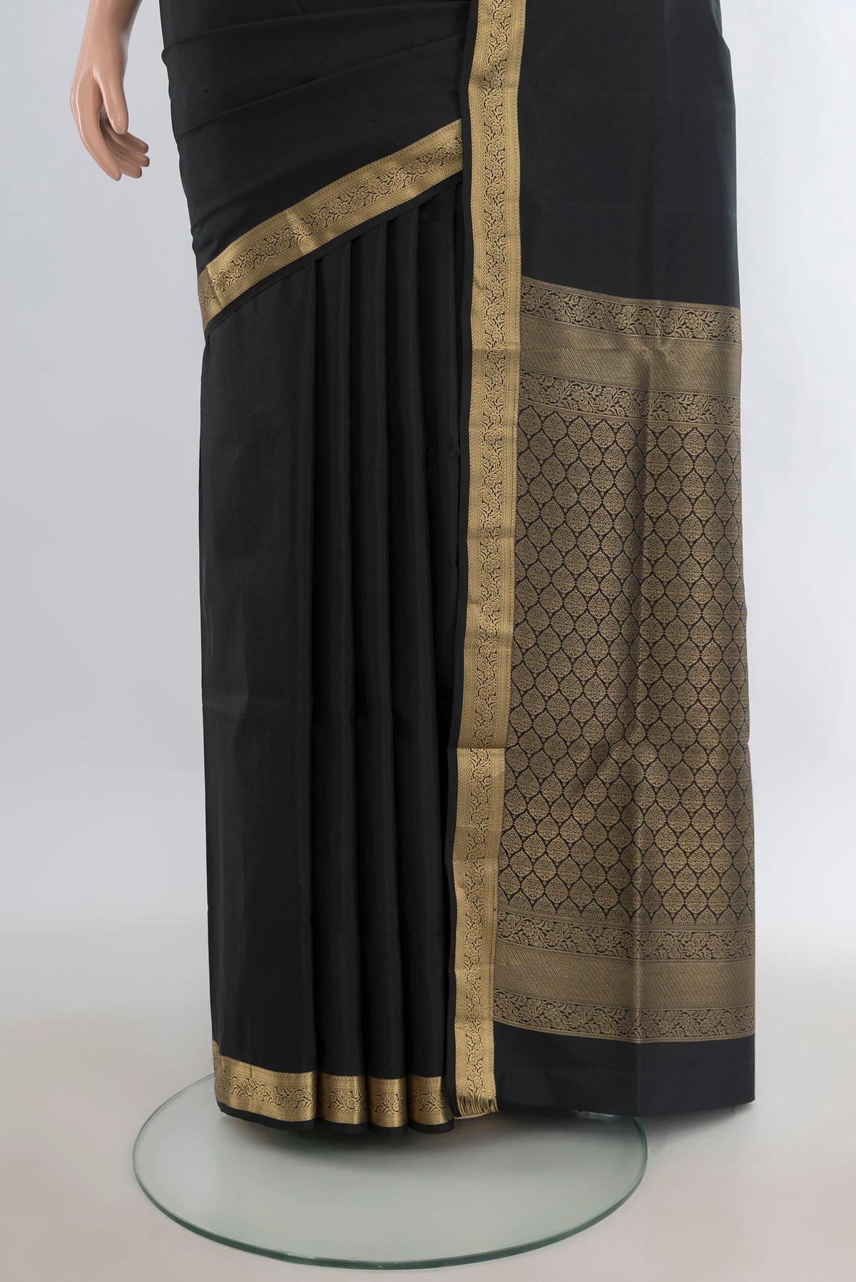 Pleats and pallu of Pure Silk Black Soft Saree with Zari Butta on the body and Zari Border. 