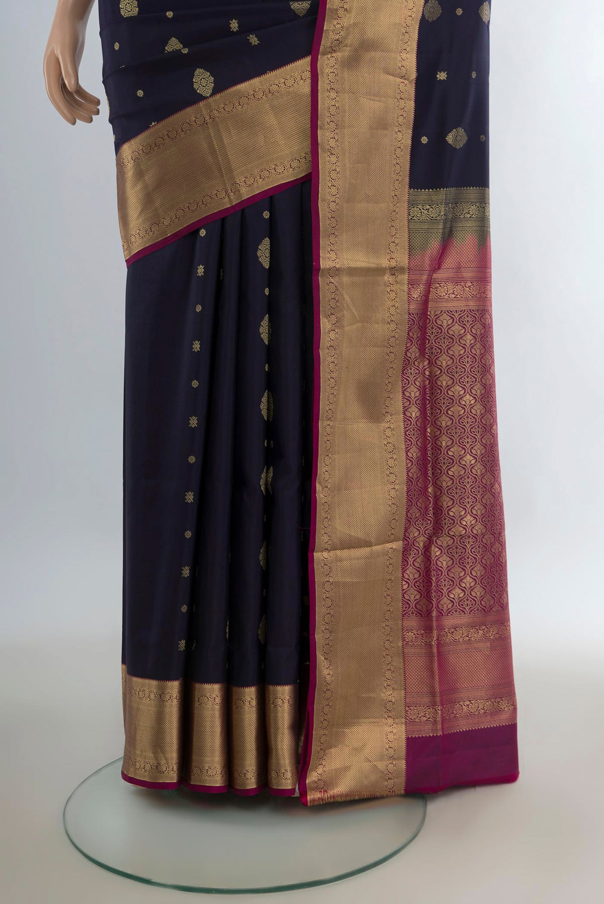Pleats and pallu of Pure Silk Navy Blue Soft Saree with Zari Butta on the body and Zari Border. 