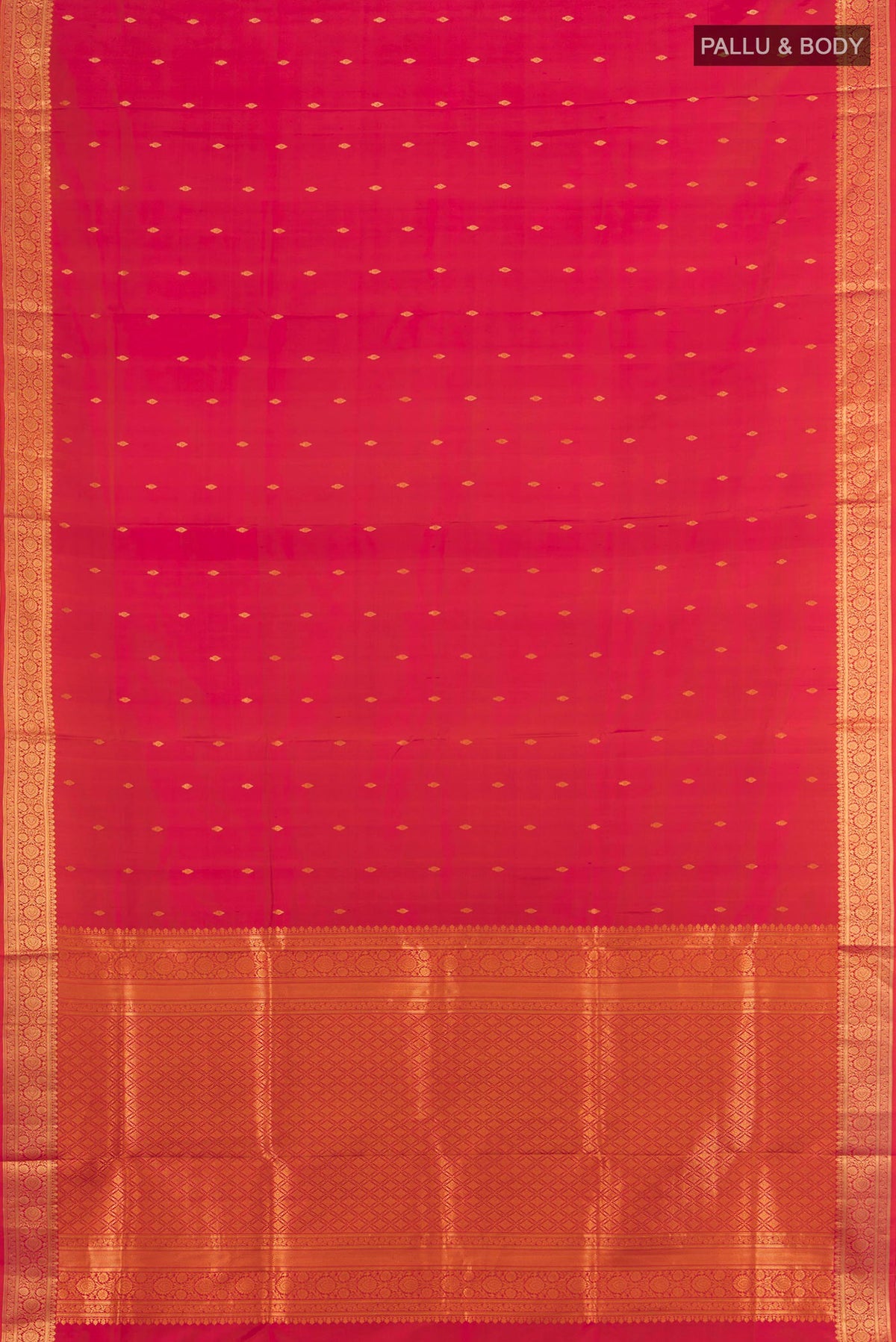 Flat view of Pure Silk Brick Orange Dual Tone Soft Saree with Zari Butta on the body and Zari Border. 