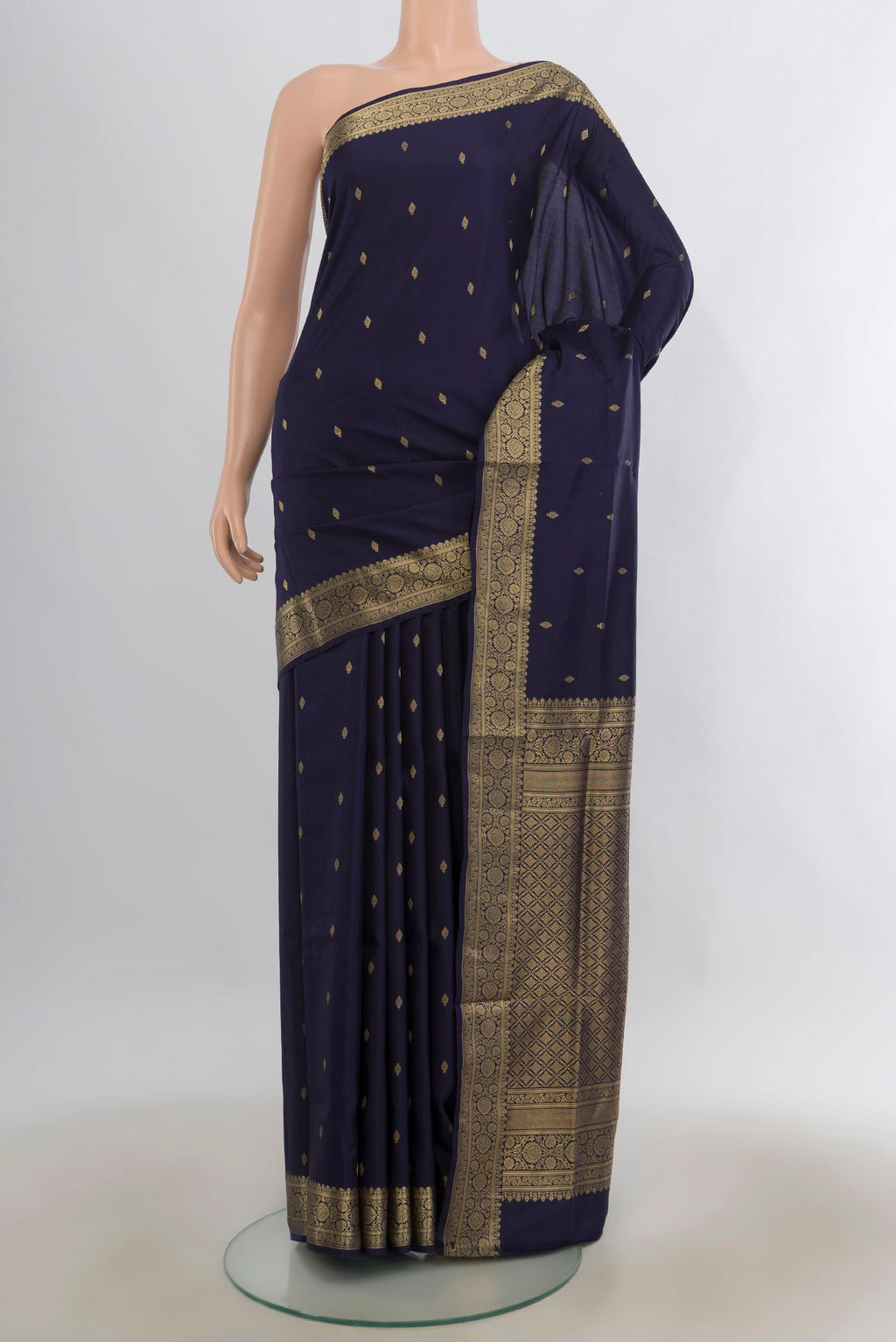 Pure Silk Navy Blue Soft Saree with Zari Butta on the body and Zari Border.  displayed on a mannequin
