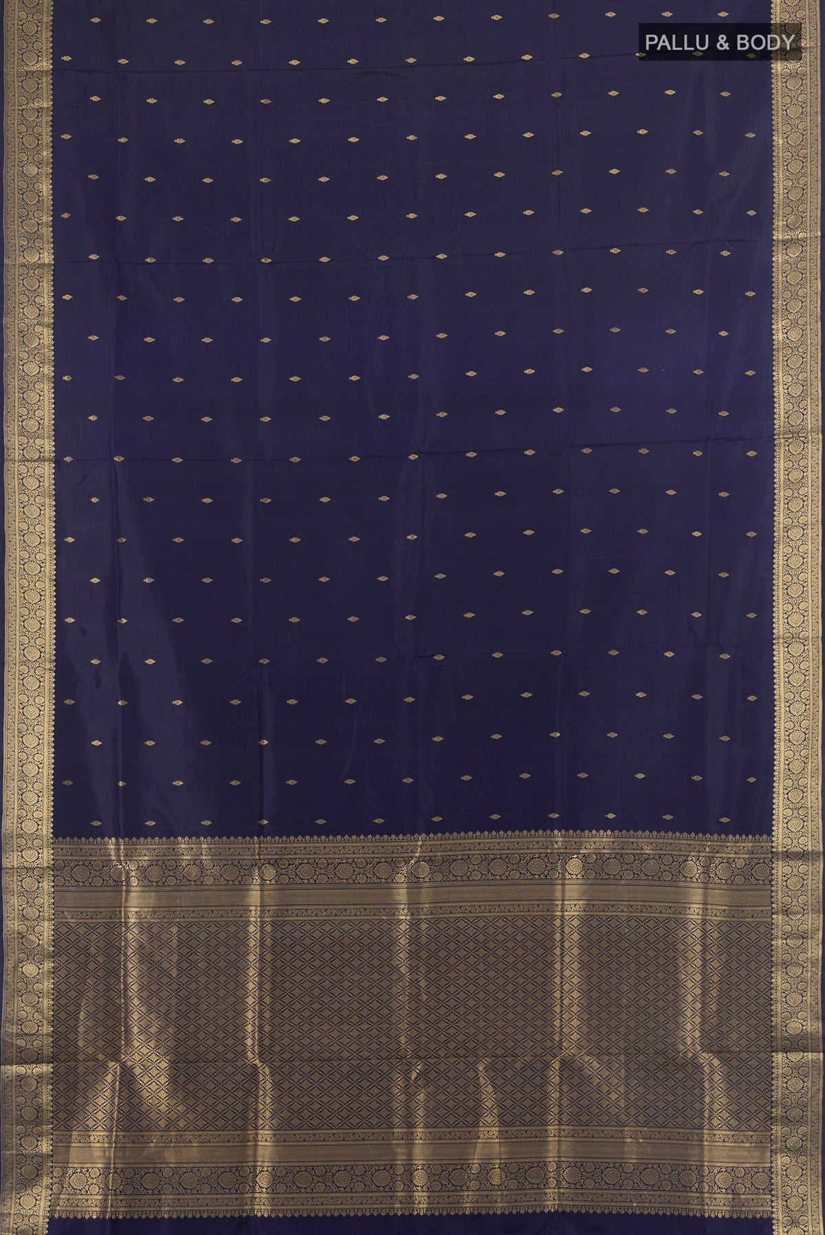 Flat view of Pure Silk Navy Blue Soft Saree with Zari Butta on the body and Zari Border. 