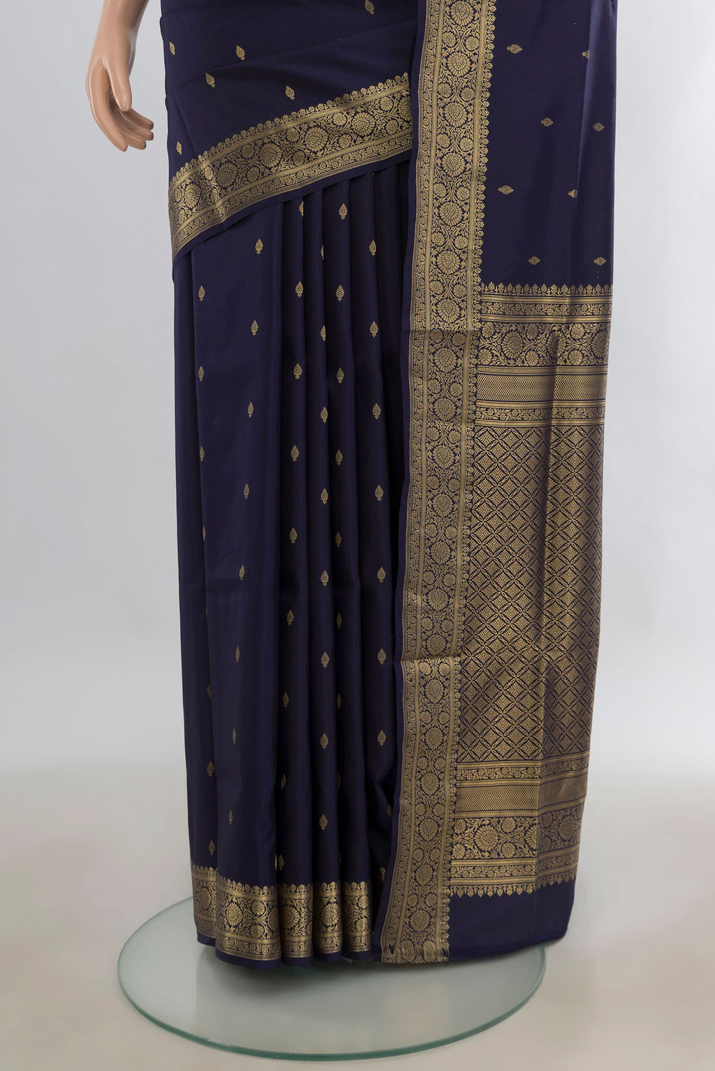 Pleats and pallu of Pure Silk Navy Blue Soft Saree with Zari Butta on the body and Zari Border. 