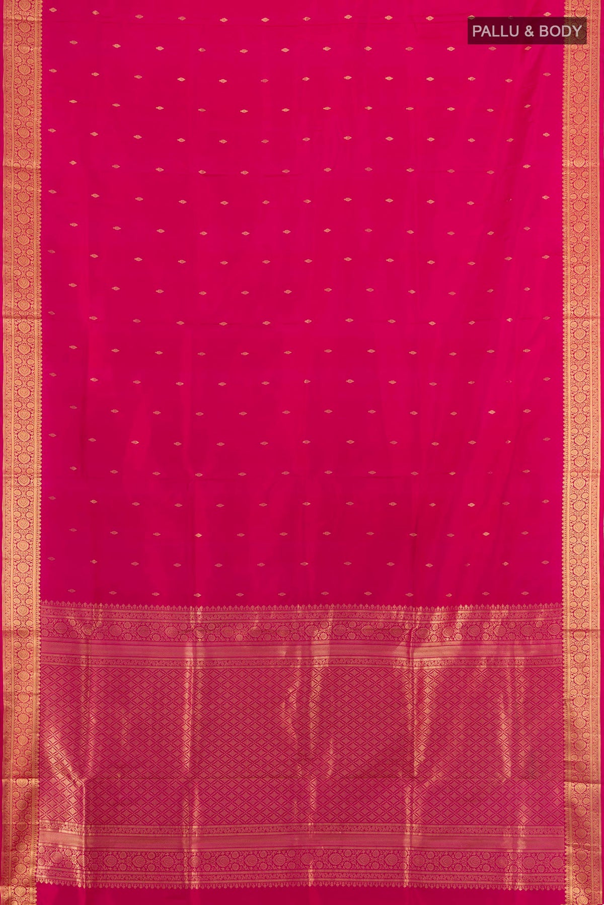 Flat view of Pure Silk Dark Pink Soft Saree with Zari Butta on the body and Zari Border. 