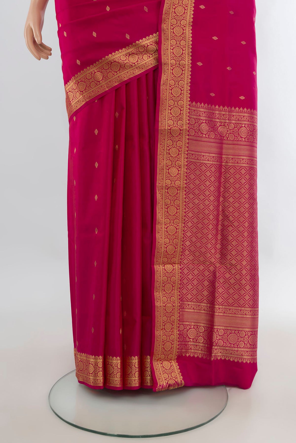 Pleats and pallu of Pure Silk Dark Pink Soft Saree with Zari Butta on the body and Zari Border. 