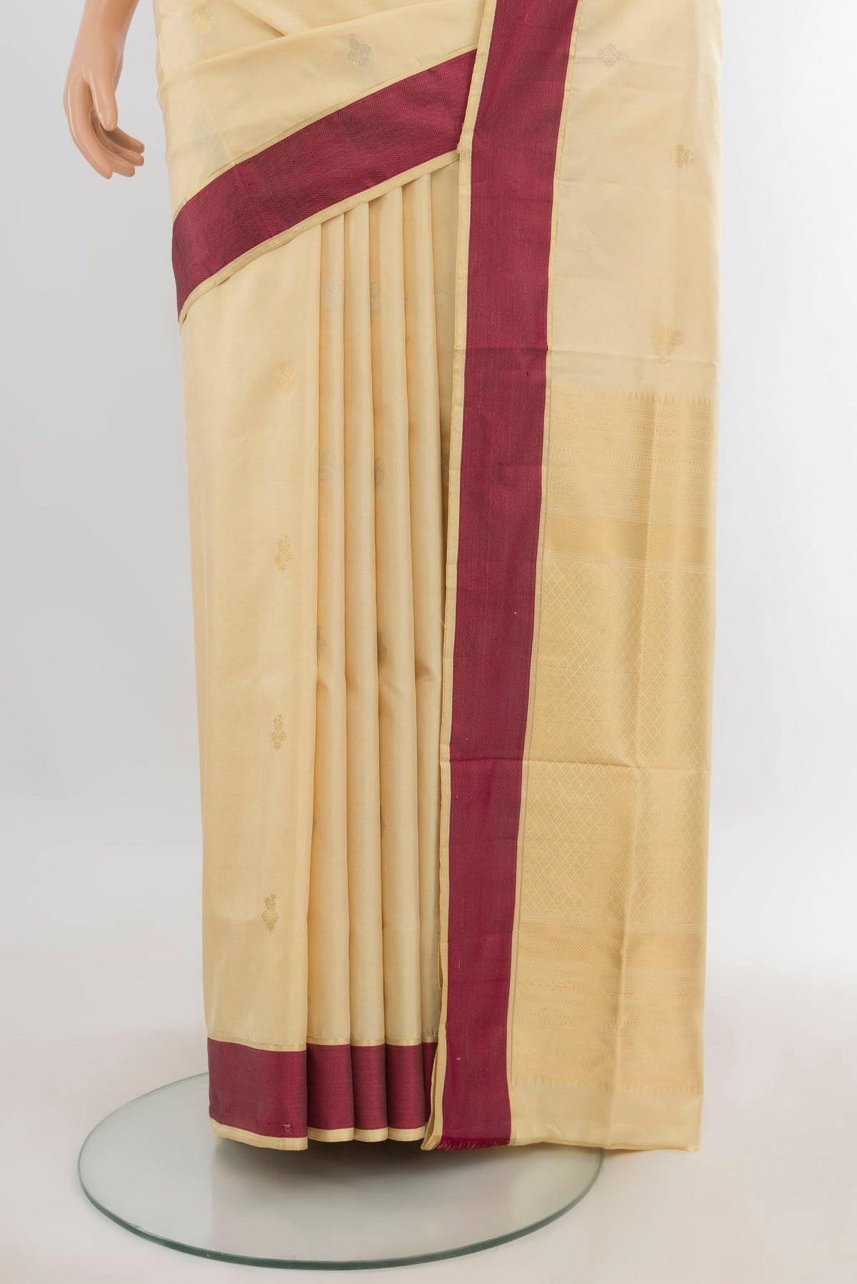 Pleats and pallu of Pure Silk Sandal Soft Saree with Zari Butta on the body and Thread Border. 