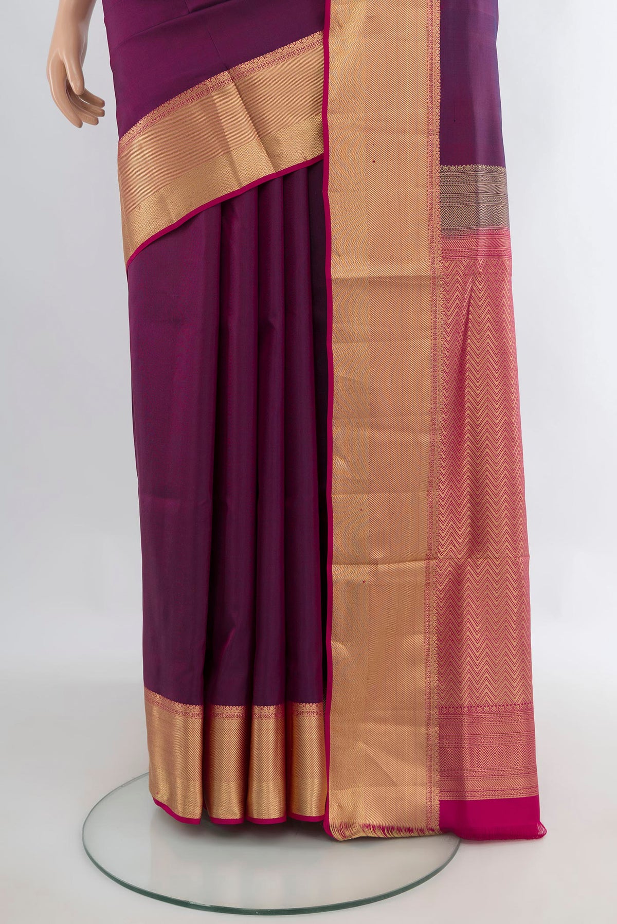 Pleats and pallu of Pure Silk Maroon Soft Saree with Plain Body and Zari Border. 
