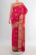 Pure Silk Coral Soft Saree with Zari Butta on the body and Zari Border.  displayed on a mannequin