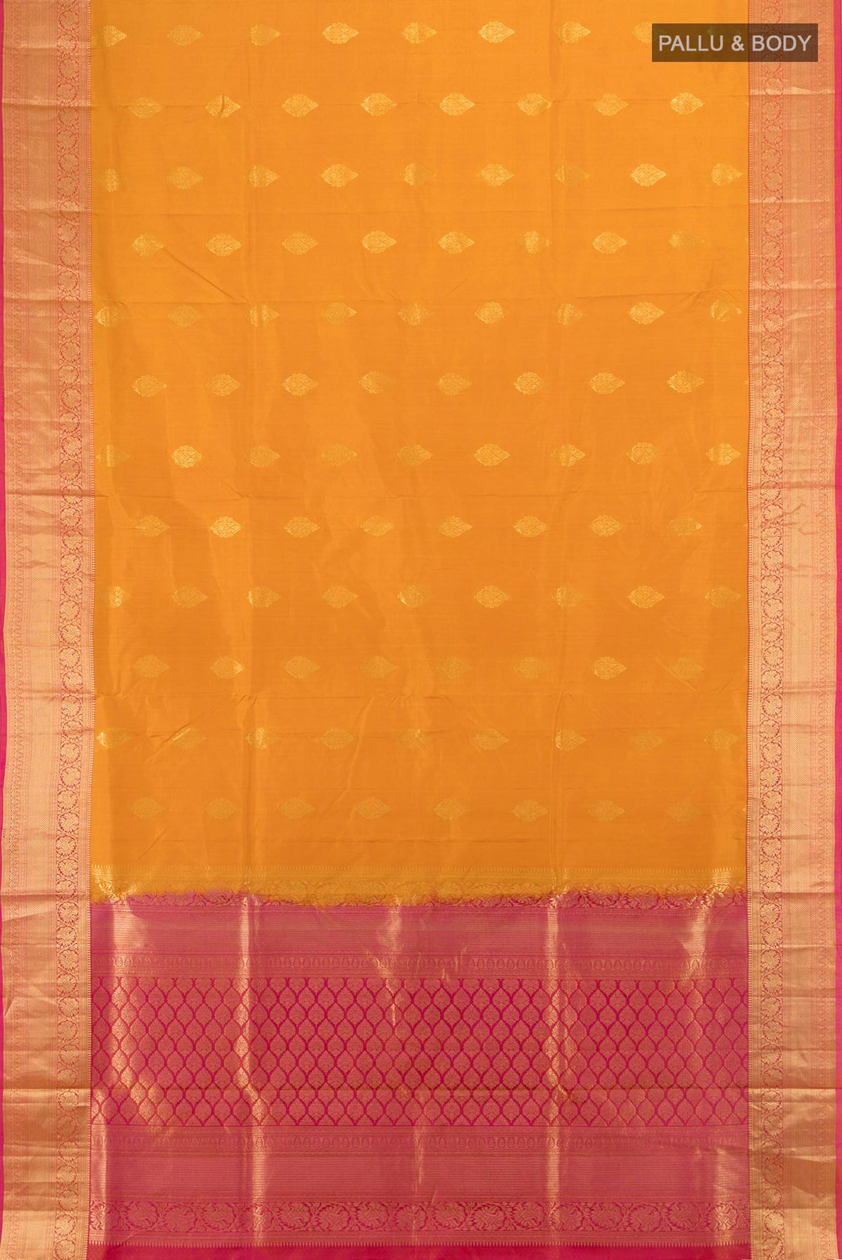 Flat view of Pure Silk Mustard Soft Saree with Zari Butta on the body and Zari Border. 