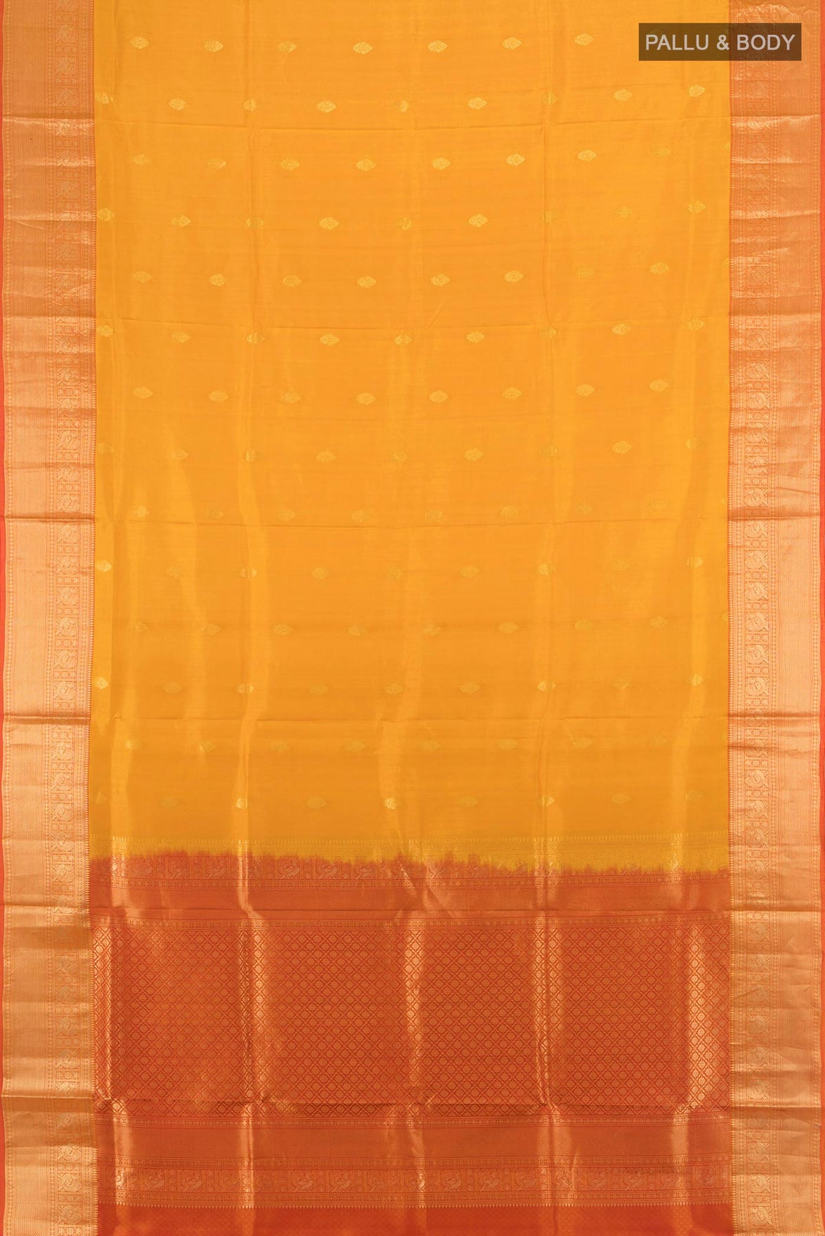 Flat view of Pure Silk Mustard Soft Saree with Zari Butta on the body and Zari Border. 