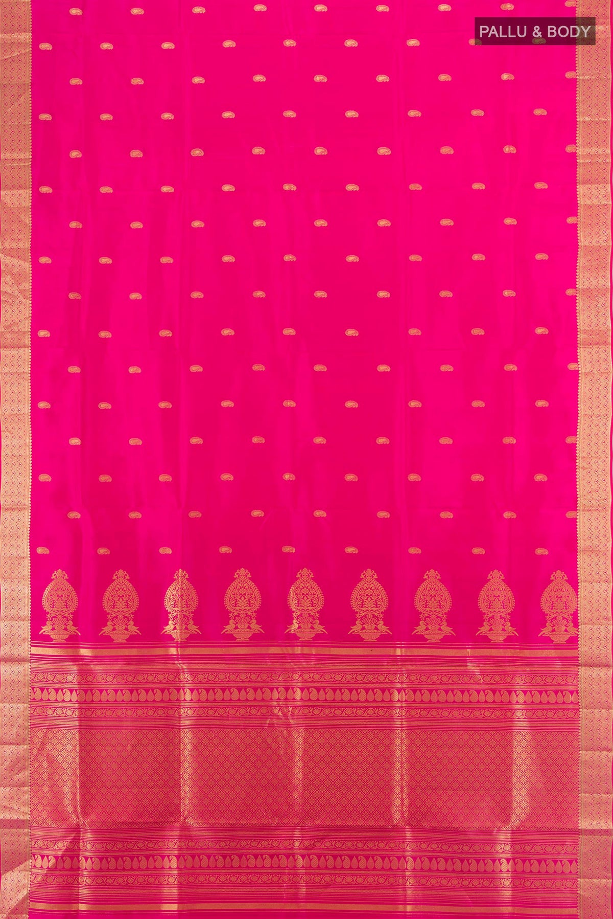 Flat view of Pure Silk Pink Soft Saree with Zari Butta on the body and Zari Border. 