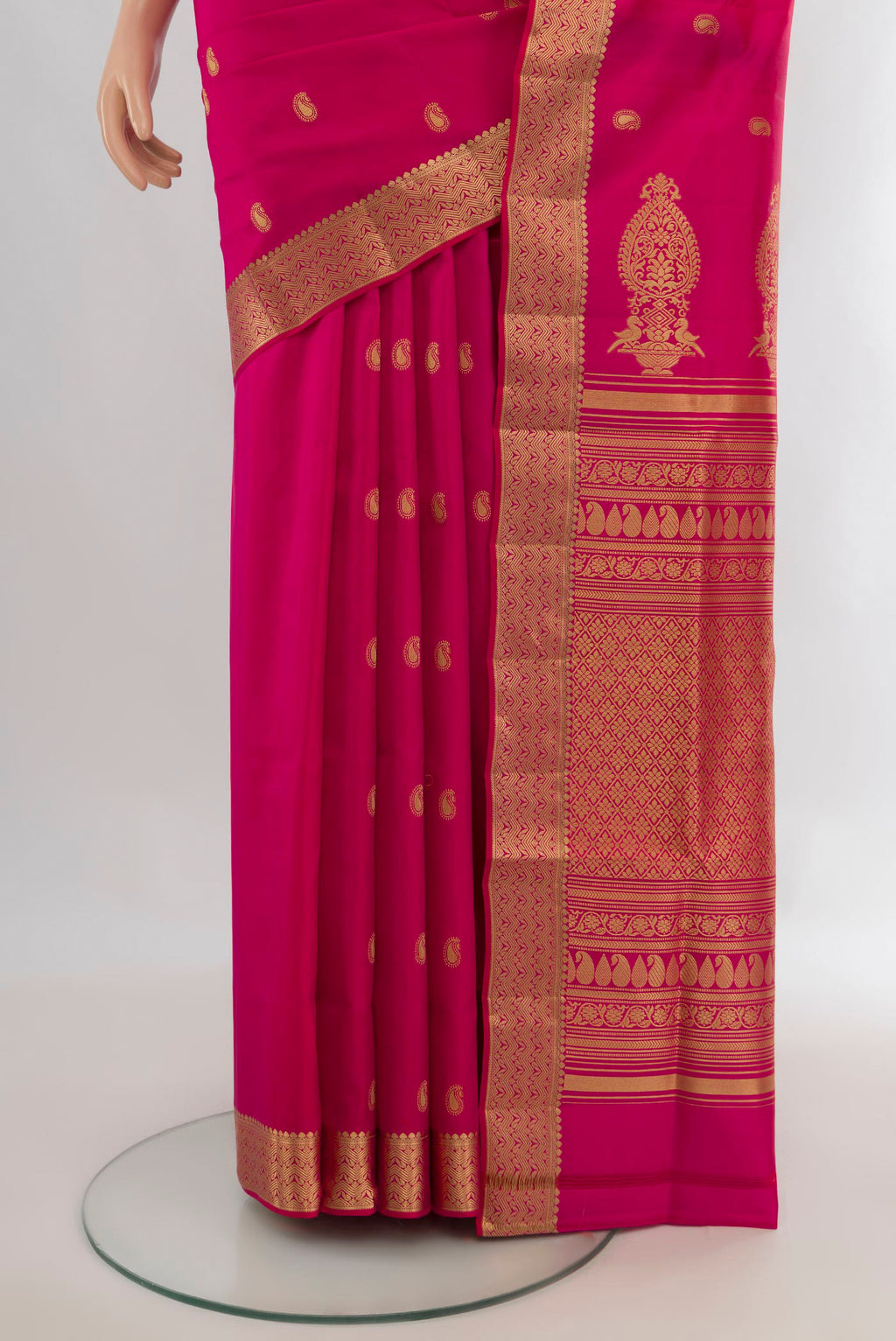 Pleats and pallu of Pure Silk Pink Soft Saree with Zari Butta on the body and Zari Border. 