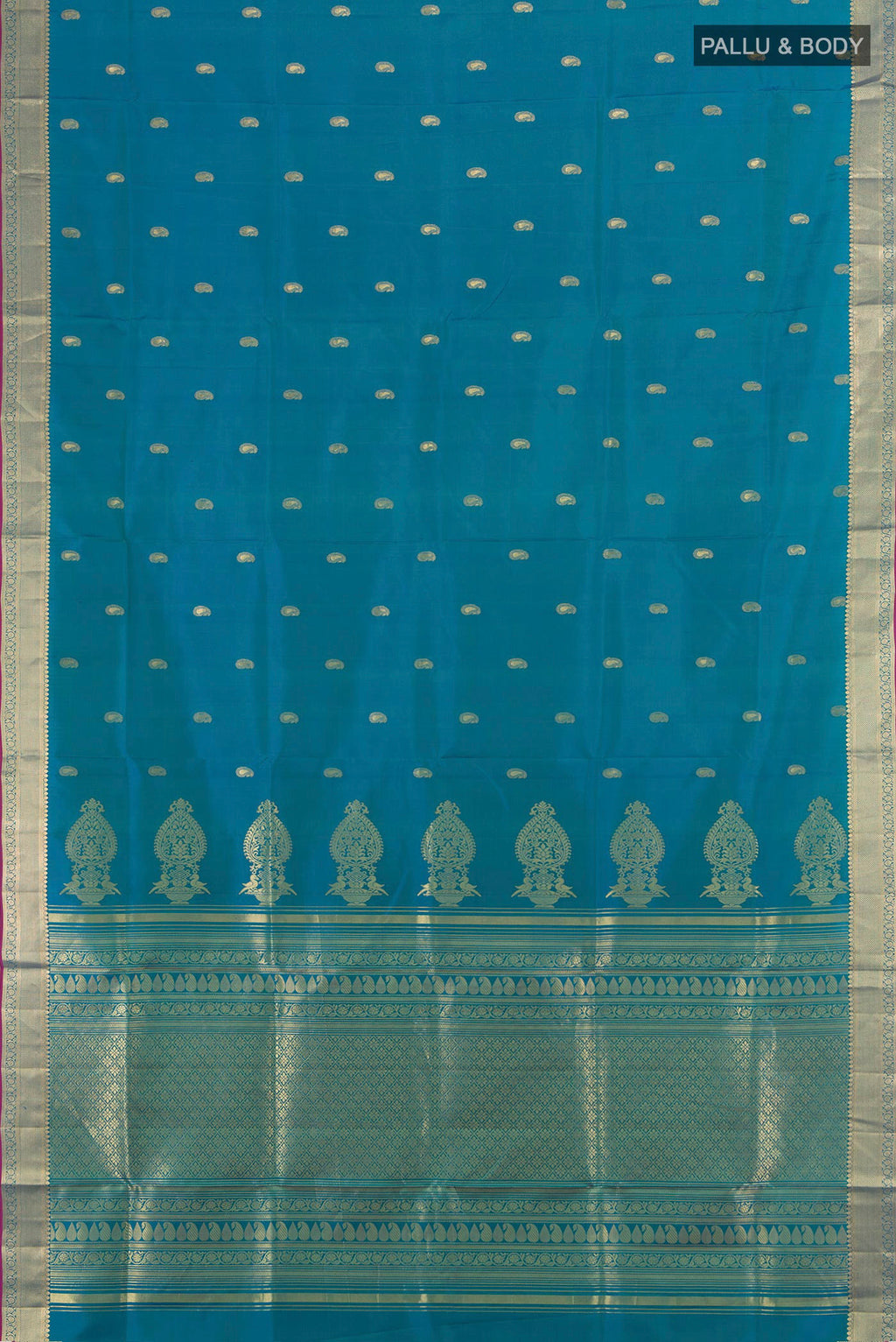 Flat view of Pure Silk Peacock Blue Soft Saree with Zari Butta on the body and Zari Border. 