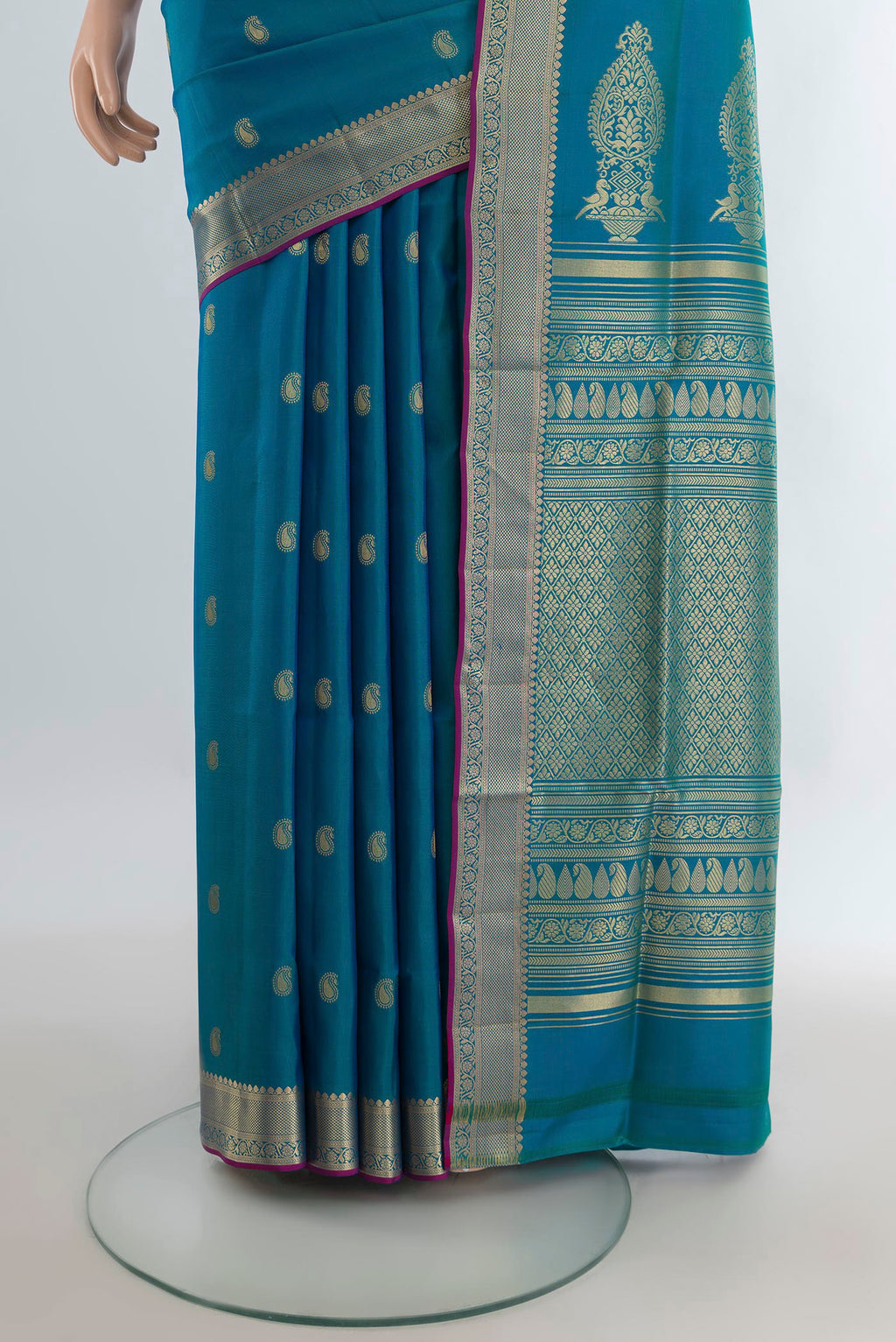 Pleats and pallu of Pure Silk Peacock Blue Soft Saree with Zari Butta on the body and Zari Border. 