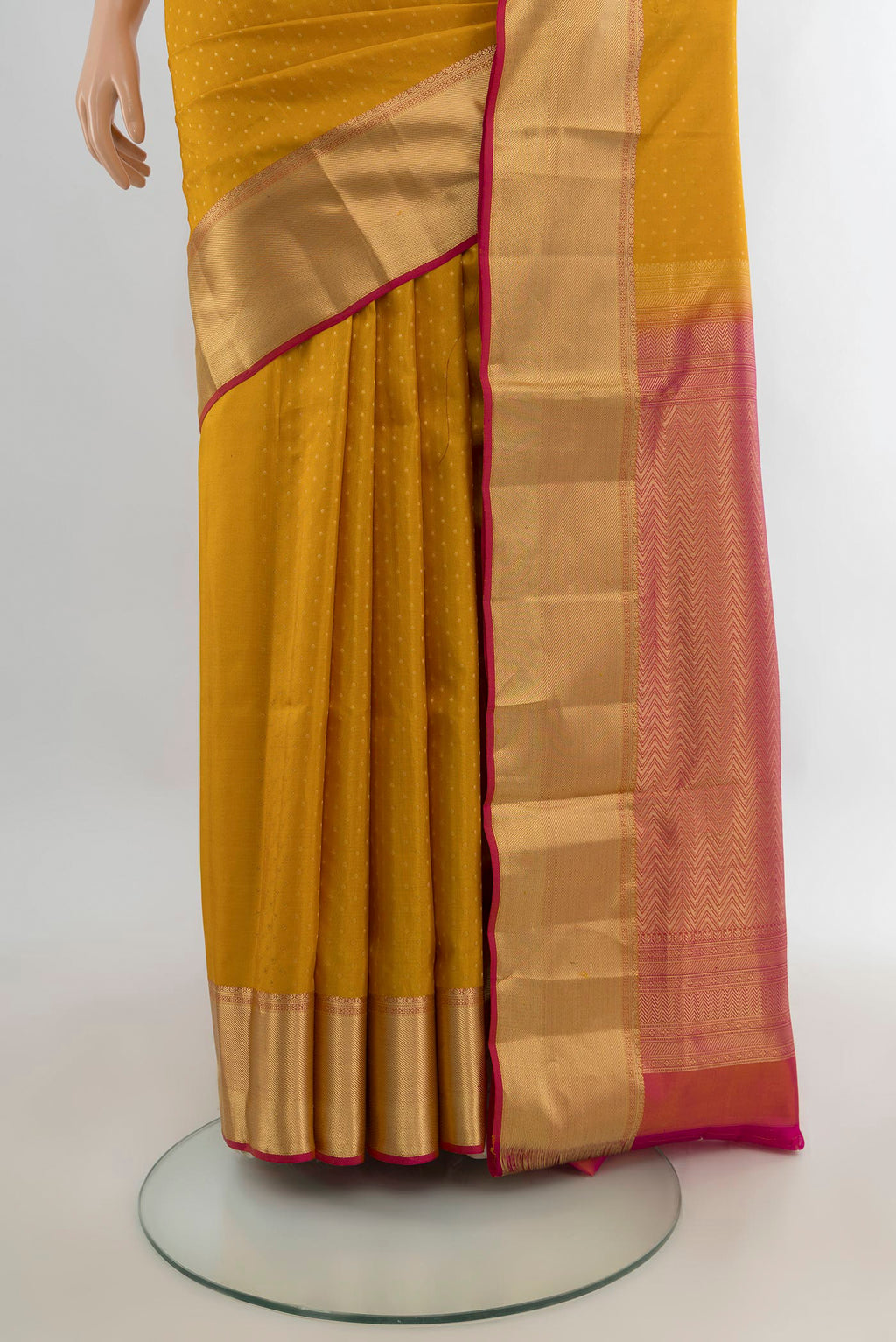 Pleats and pallu of Pure Silk Mustard Soft Saree with Jacquard design on the body and Zari Border. 
