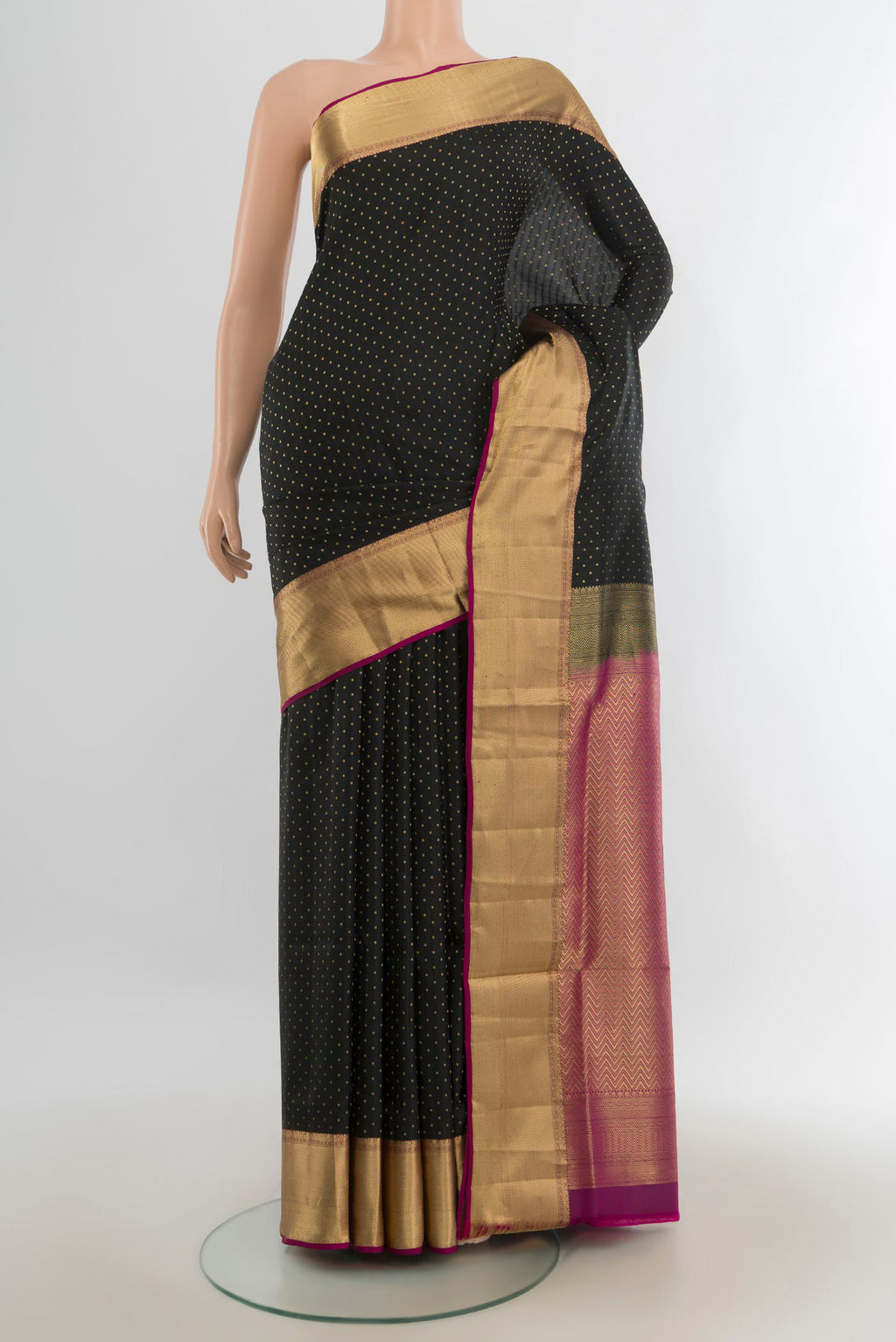 Pure Silk Black Soft Saree with Zari Butta on the body and Silk Border.  displayed on a mannequin