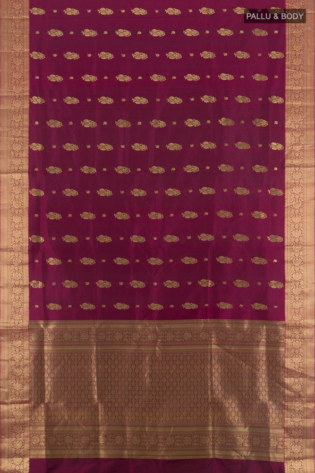 Flat view of Pure Silk Maroon Soft Saree with Zari Butta on the body and Zari Border. 
