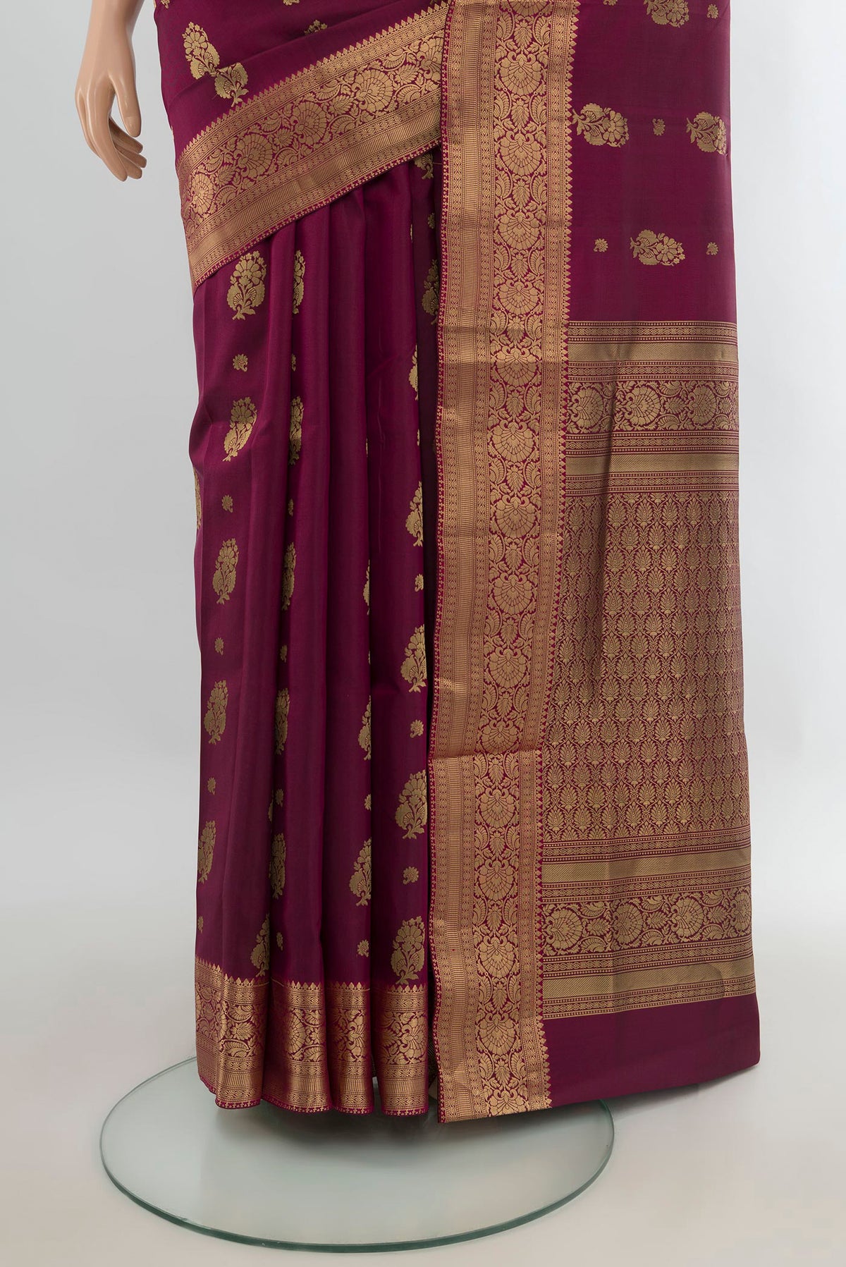 Pleats and pallu of Pure Silk Maroon Soft Saree with Zari Butta on the body and Zari Border. 