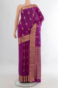 Pure Silk Magenta Soft Saree with Zari Butta on the body and Zari Border.  displayed on a mannequin