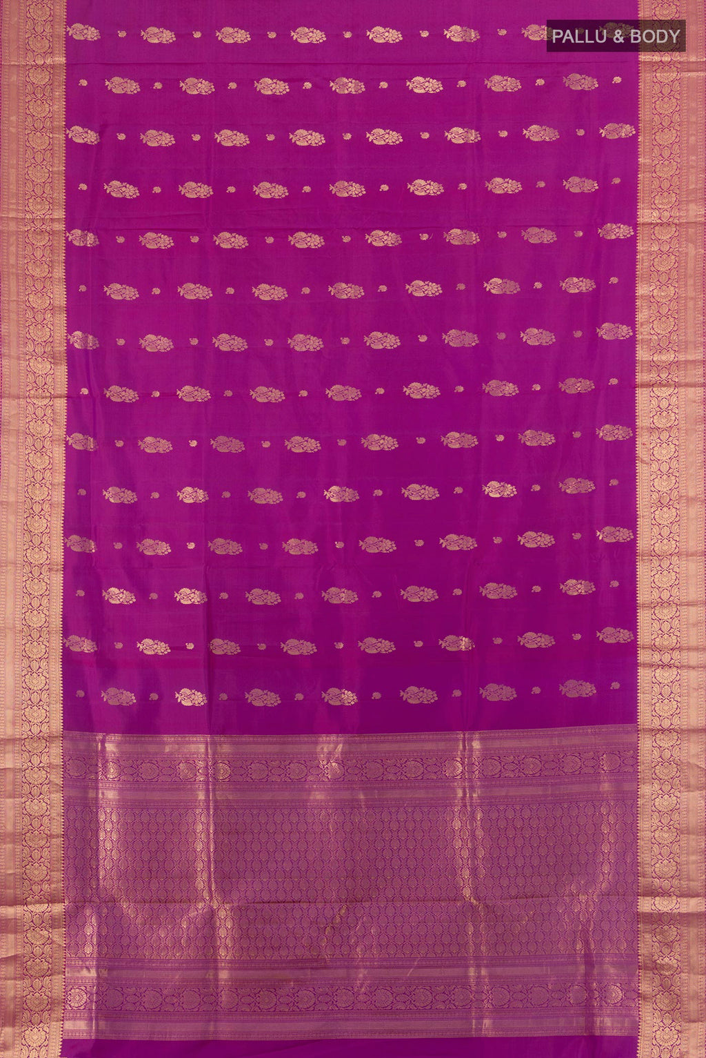 Flat view of Pure Silk Magenta Soft Saree with Zari Butta on the body and Zari Border. 