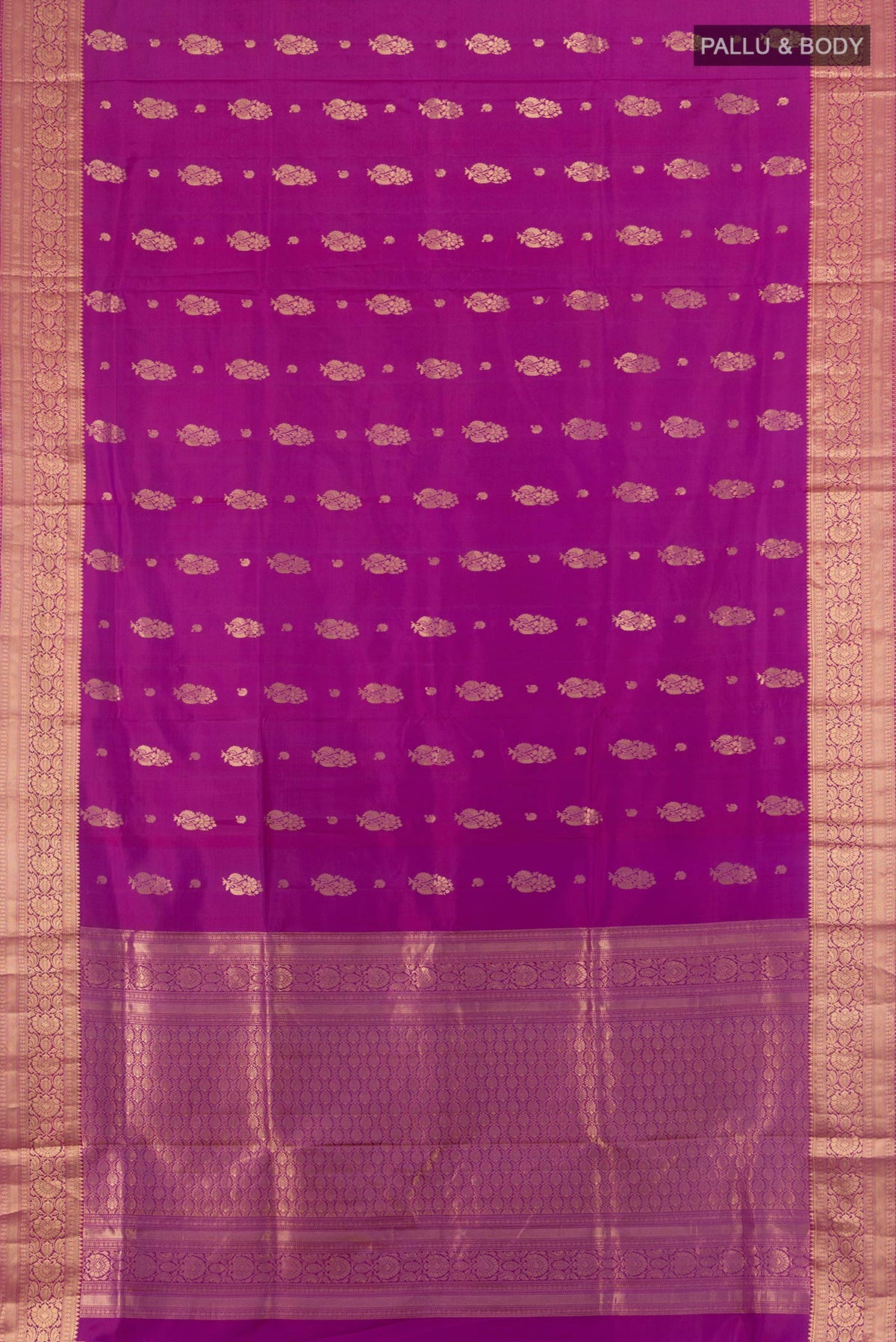Flat view of Pure Silk Magenta Soft Saree with Zari Butta on the body and Zari Border. 