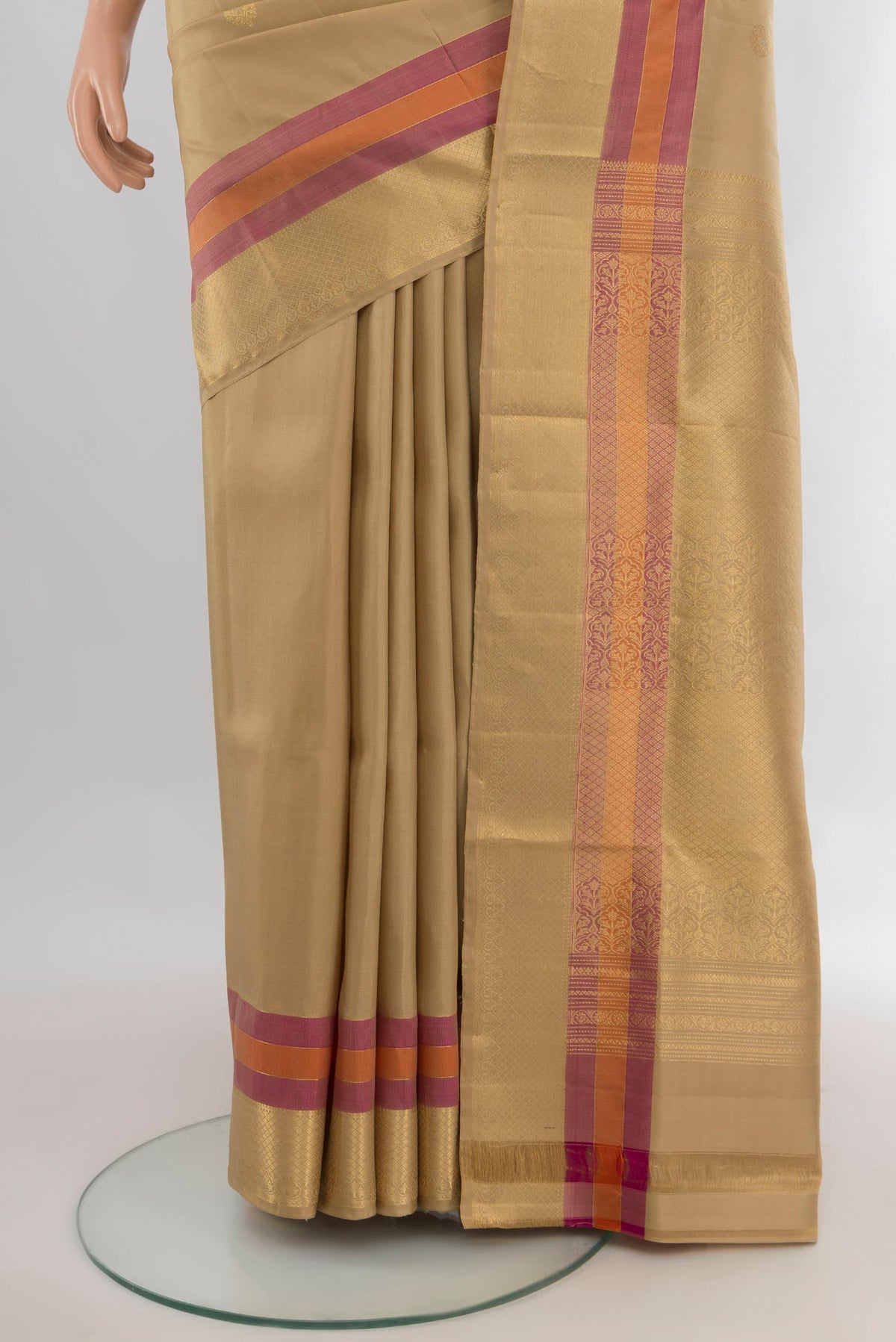 Pleats and pallu of Pure Silk Sandal Soft Saree with Zari Butta on the body and Zari Border. 