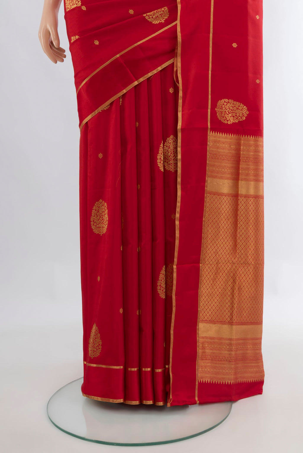Pleats and pallu of Pure Silk Red Soft Saree with Zari Butta on the body and Plain Border. 