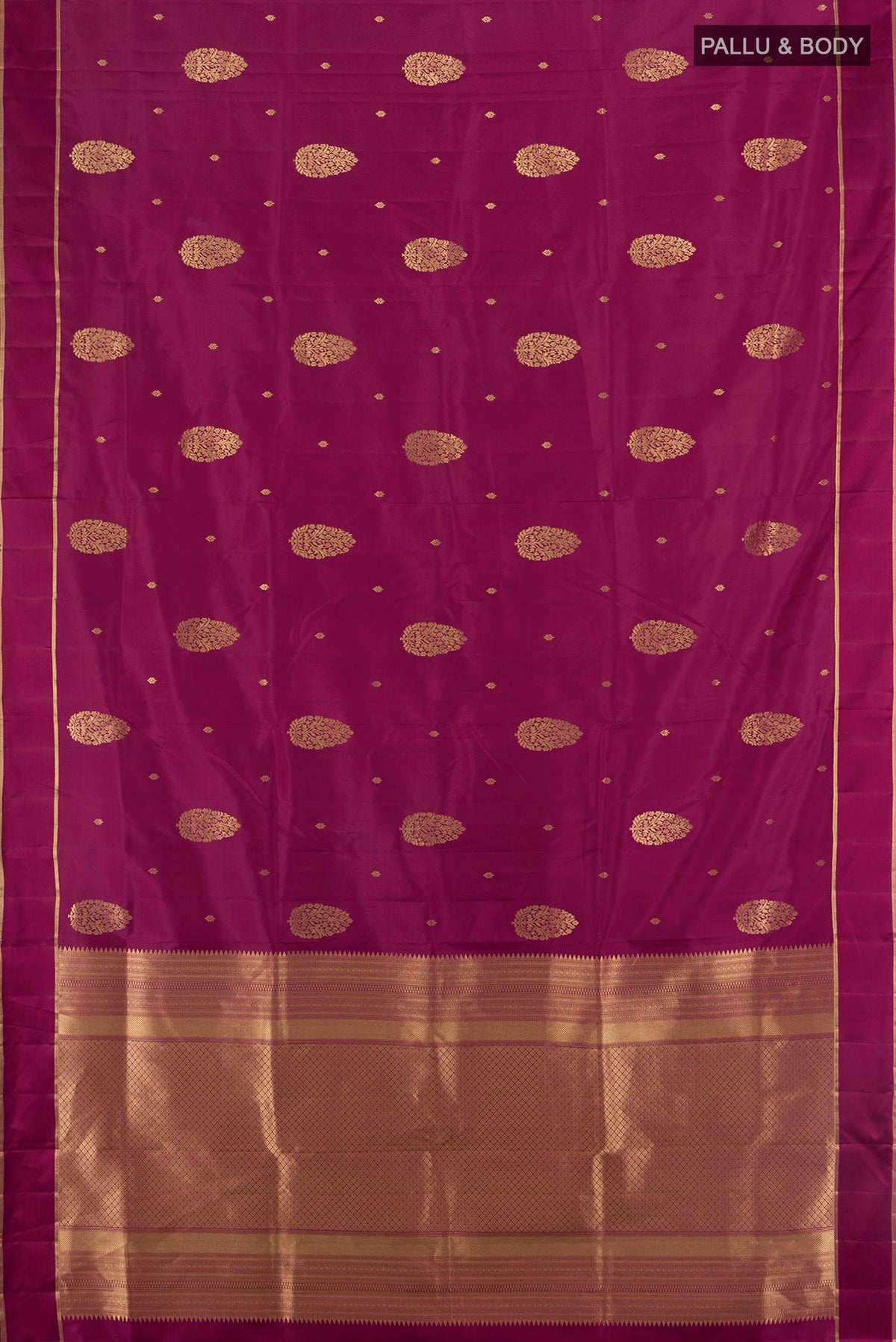 Flat view of Pure Silk Maroon Soft Saree with Zari Butta on the body and Plain Border. 