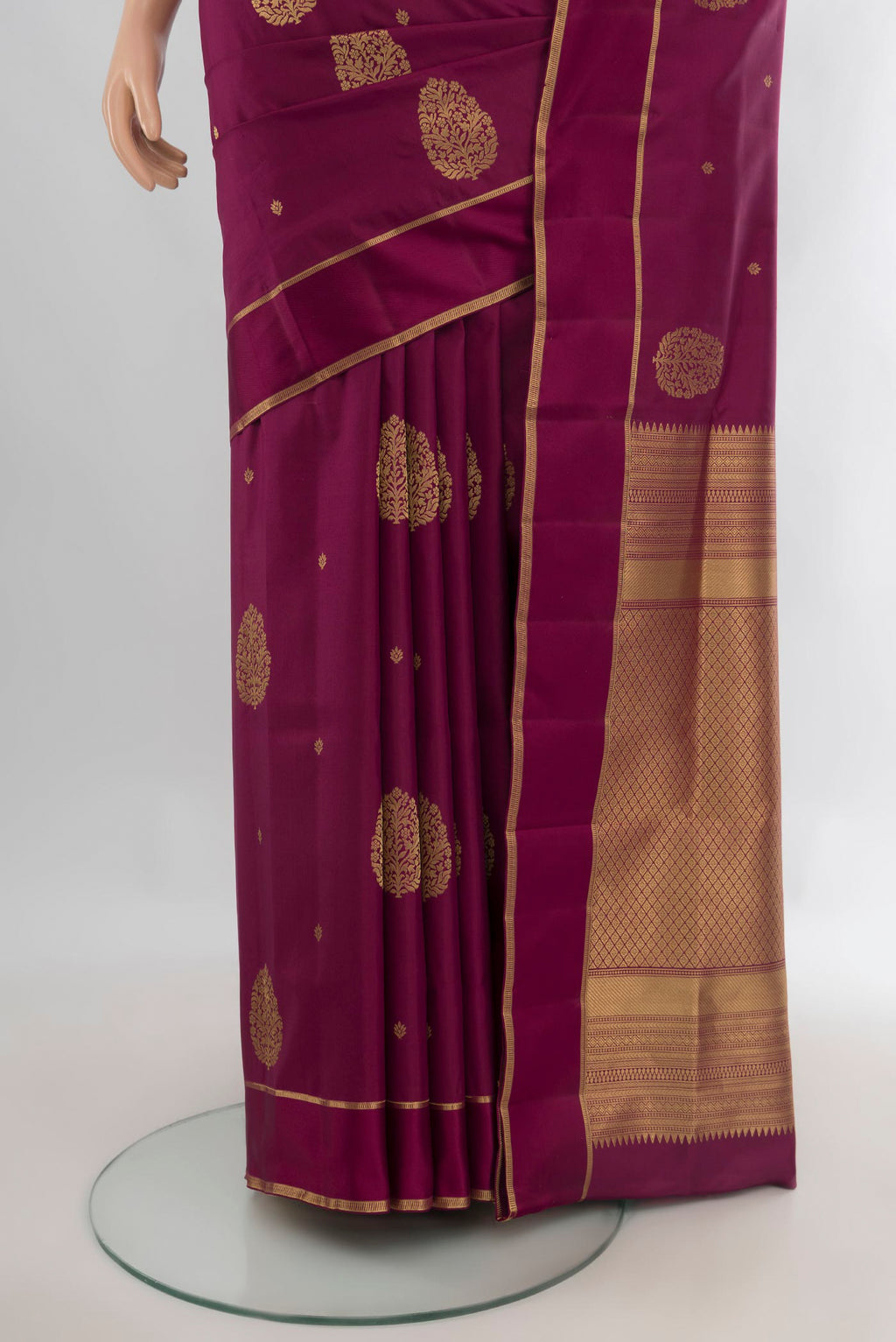 Pleats and pallu of Pure Silk Maroon Soft Saree with Zari Butta on the body and Plain Border. 