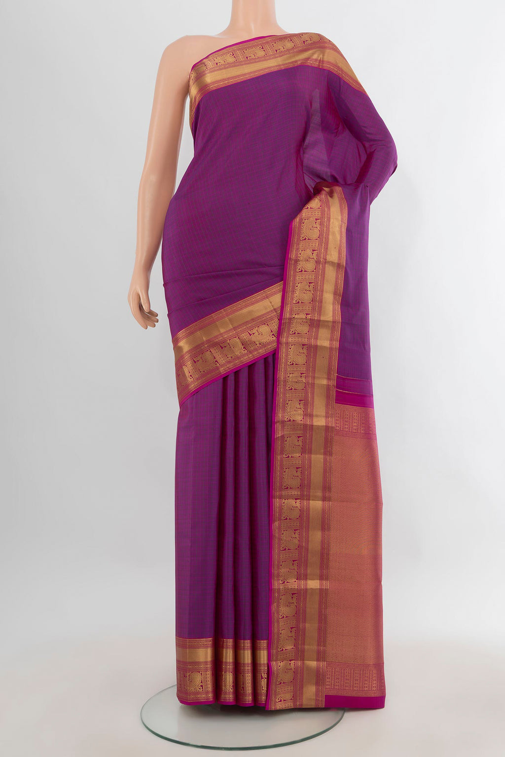 Pure Silk Purple Kanchipuram Saree with Checked design on the body and Zari Border.  displayed on a mannequin
