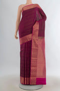 Pure Silk Maroon Kanchipuram Saree with Zari Butta on the body and Zari Border.  displayed on a mannequin